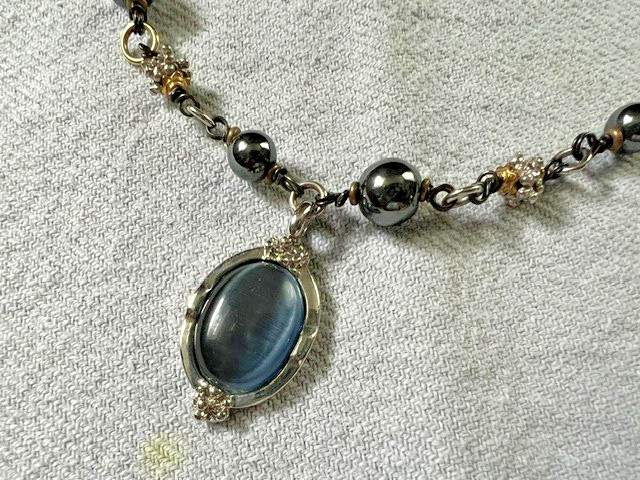 HEMATITE GRAY BEAD NECKLACE WITH SILVER/GOLD TONED SPACERS AND CABACHON PENDANT