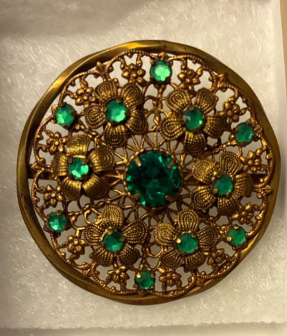 Round pin with green stones / 1.5 inch diameter / circa 1930s