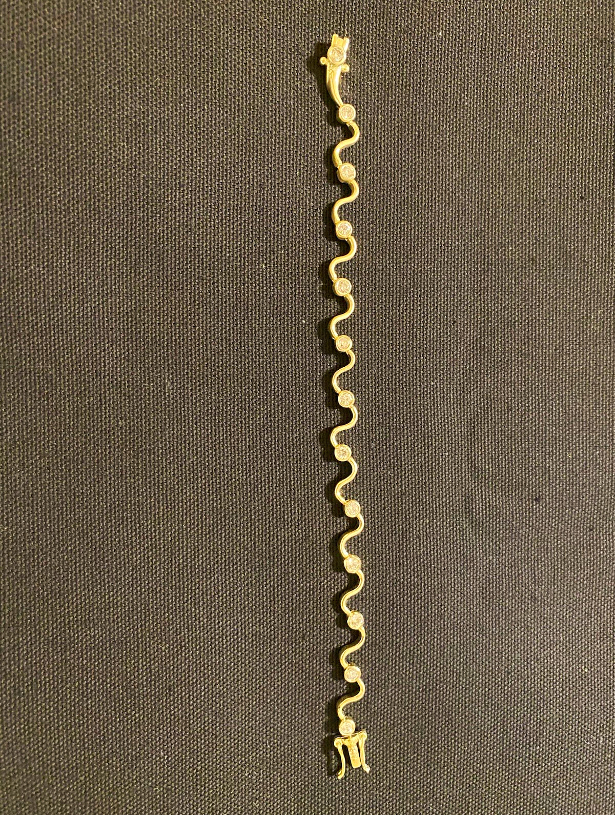 Sterling Silver Wavy Chain Bracelet with Clear Round Bezel Set Stones 7”