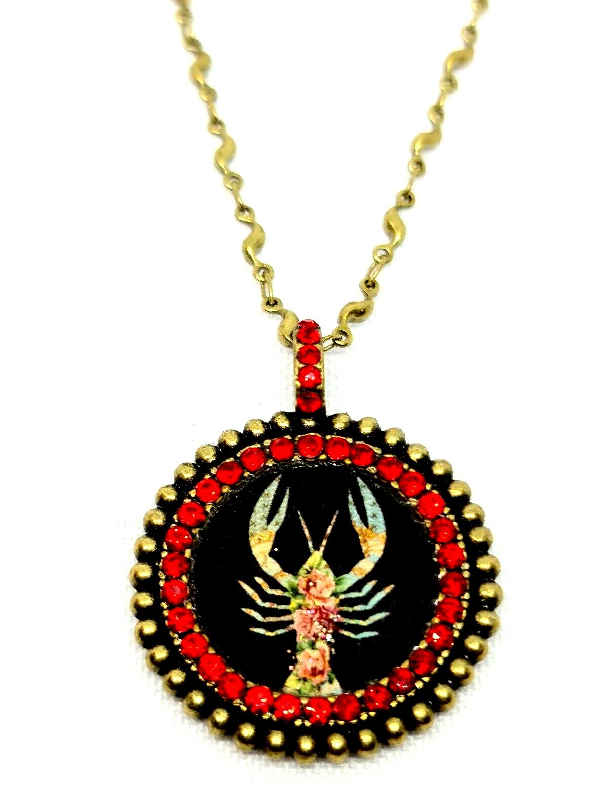 Lovely round Metal Necklace By Michal Negrin Red Crystal Cancer Sign.