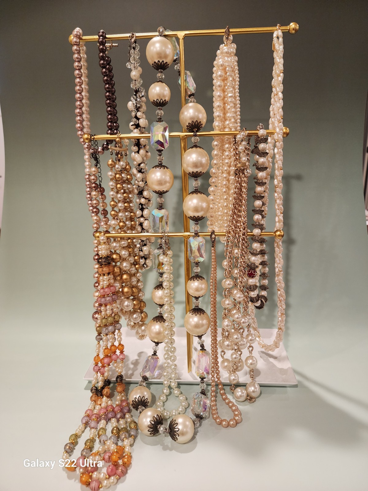 Twelve Faux Pearl Necklaces Of Varying Colors And Ornate Decorations. Varied…