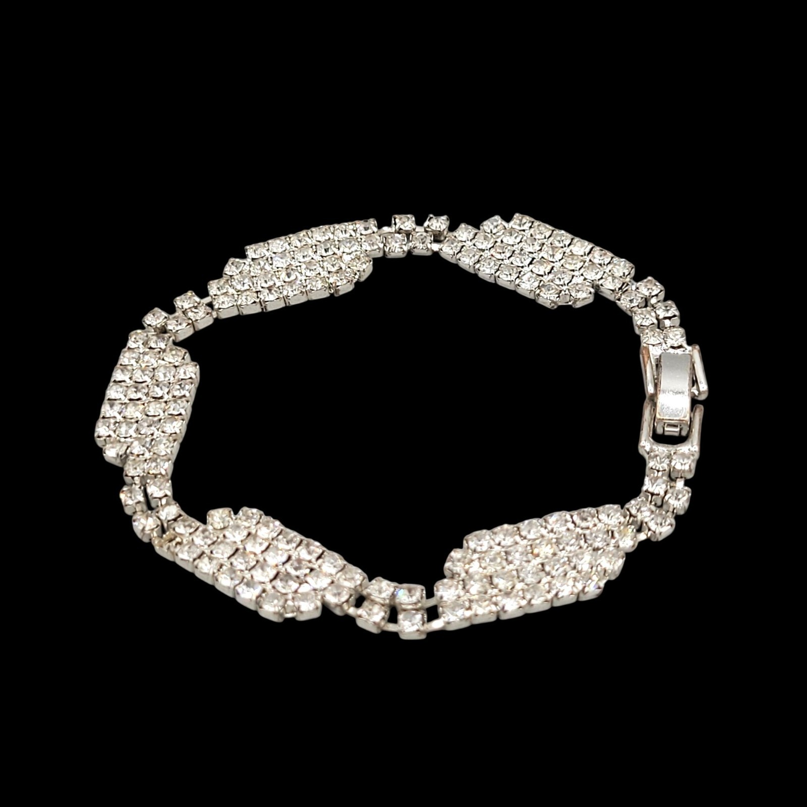 Silver Tone Bracelet With Cascading Multi Row Rhinestones Fold Over Clasp