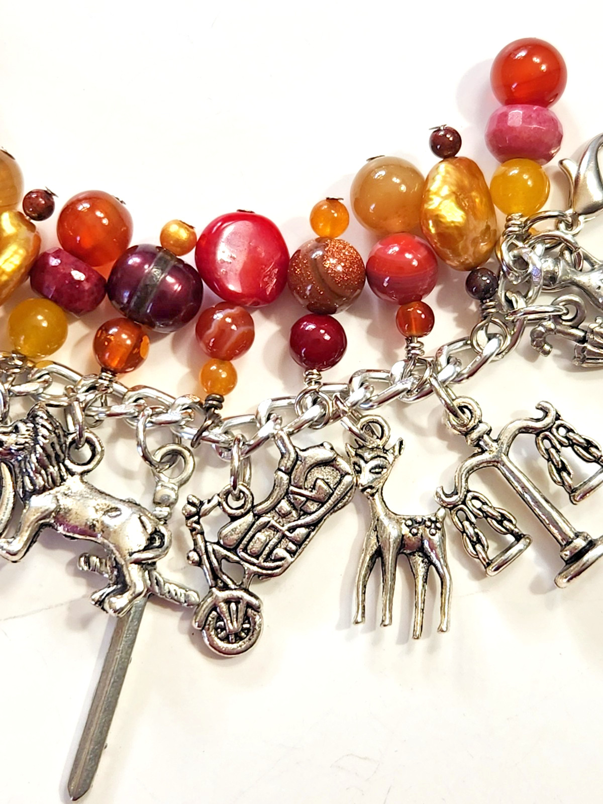 Silvertone Bracelet Multiple Dangle Charms Stone/Glass Beads Sword Lion Wolf