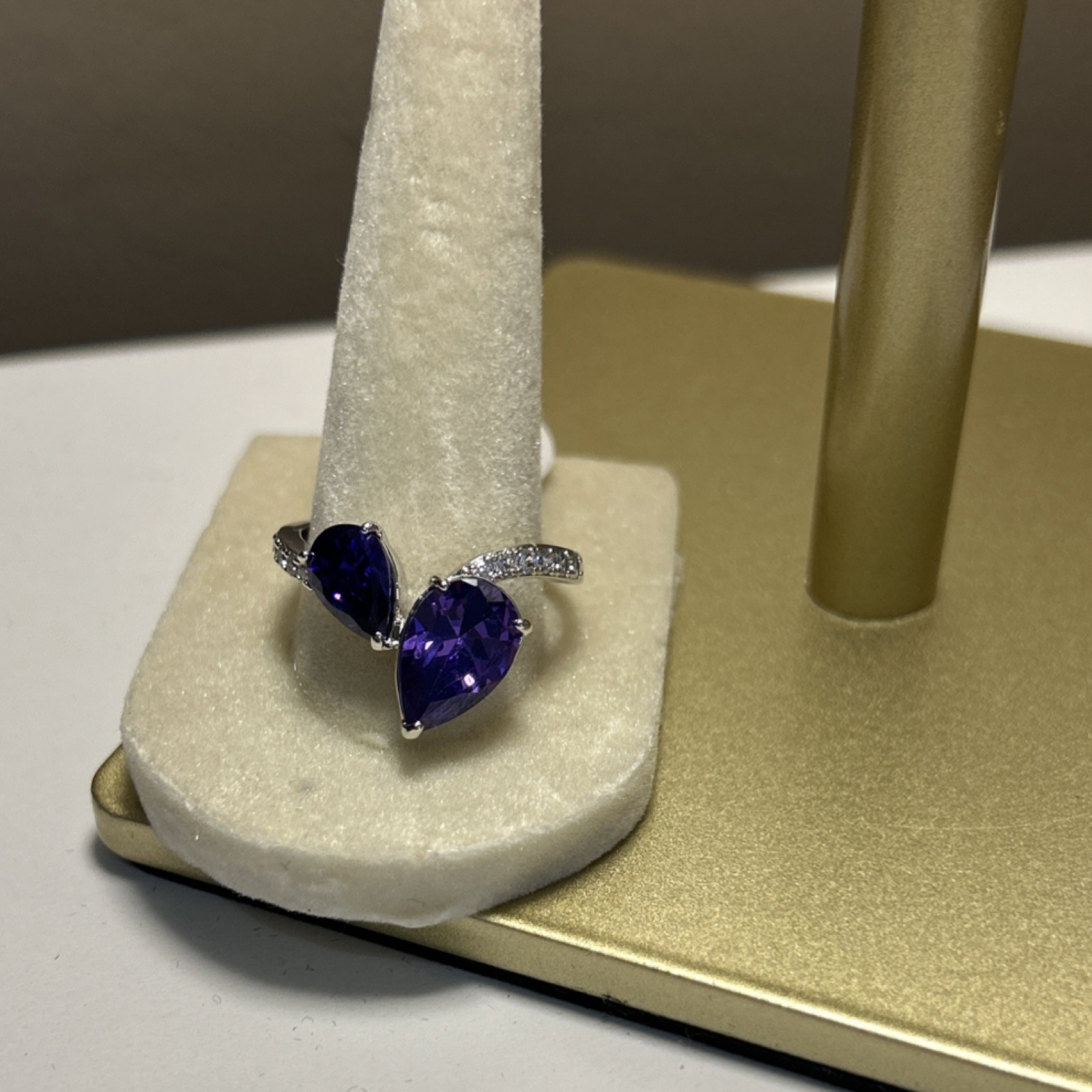 Rhodium plated two pear-shaped lab created purple amethyst stones, prong set