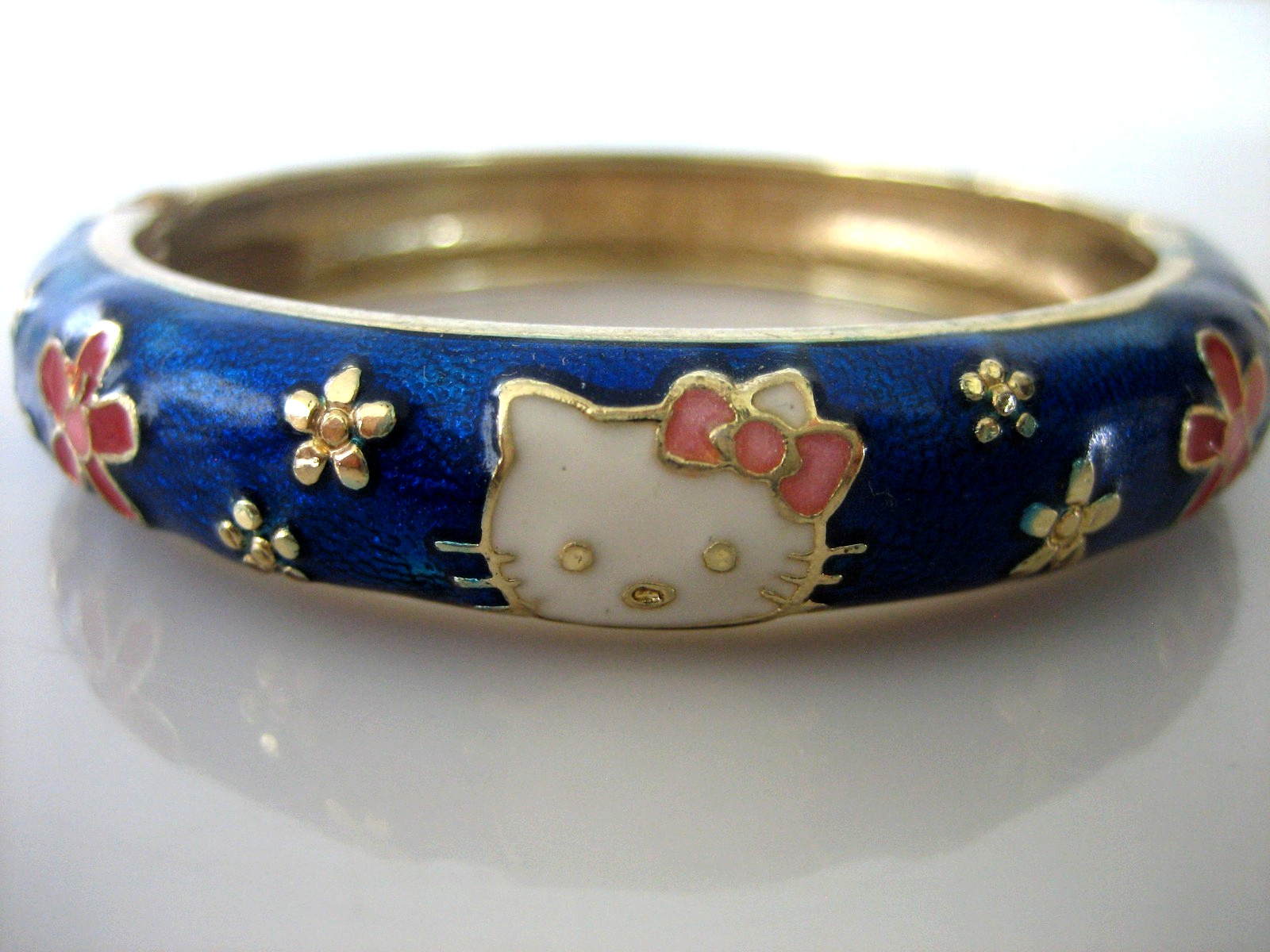 JIU LONG XING Hello Kitty Gold Tone & Blue Enamel Hinged Bangle Bracelet