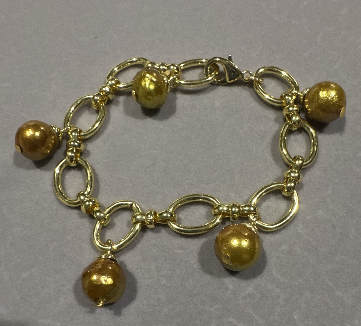 Genuine Golden-Avocado color Freshwater pearls in micron-setting. 11-11.5 MM