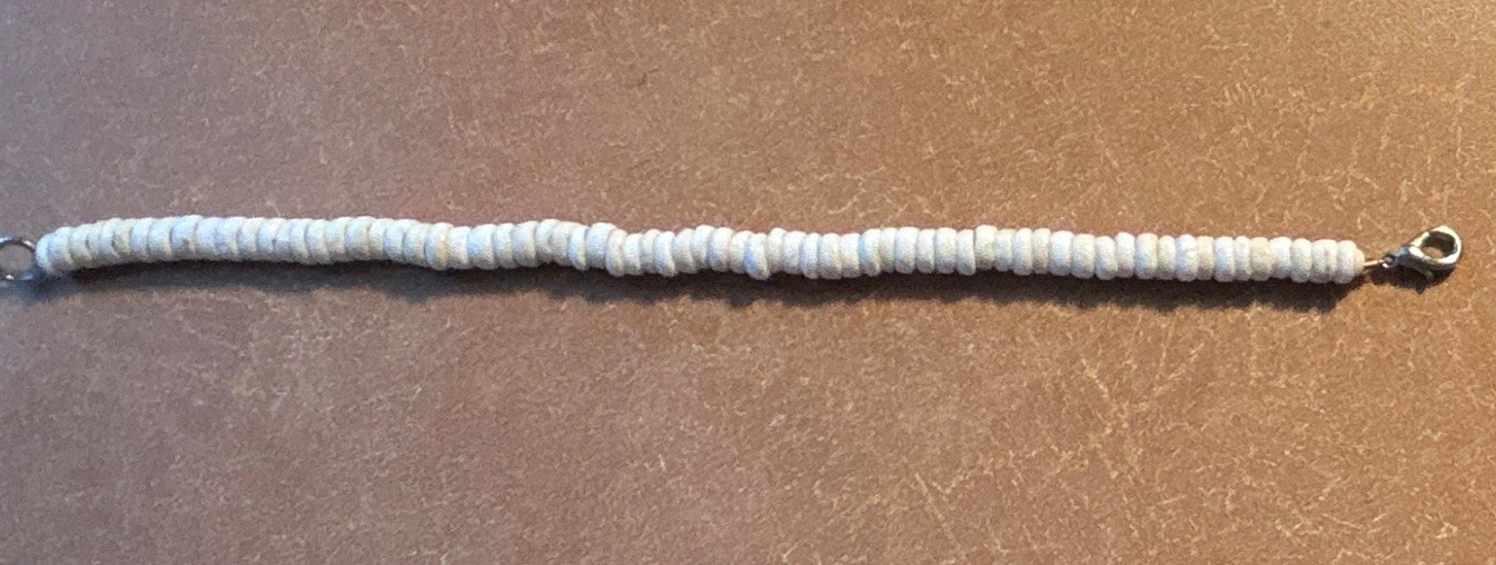 Vintage white puka shell heishe bead, lobster clasp. Length 8 1/2”