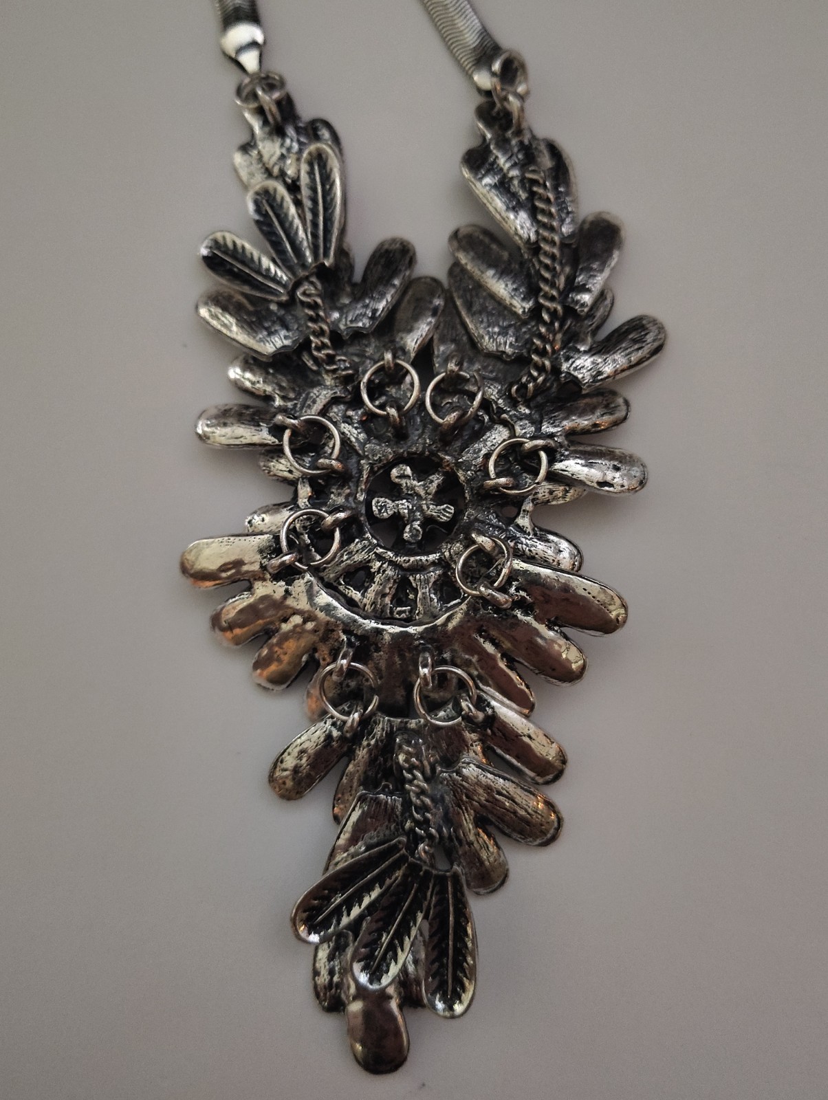 Beautiful silver/tone feather statement necklace