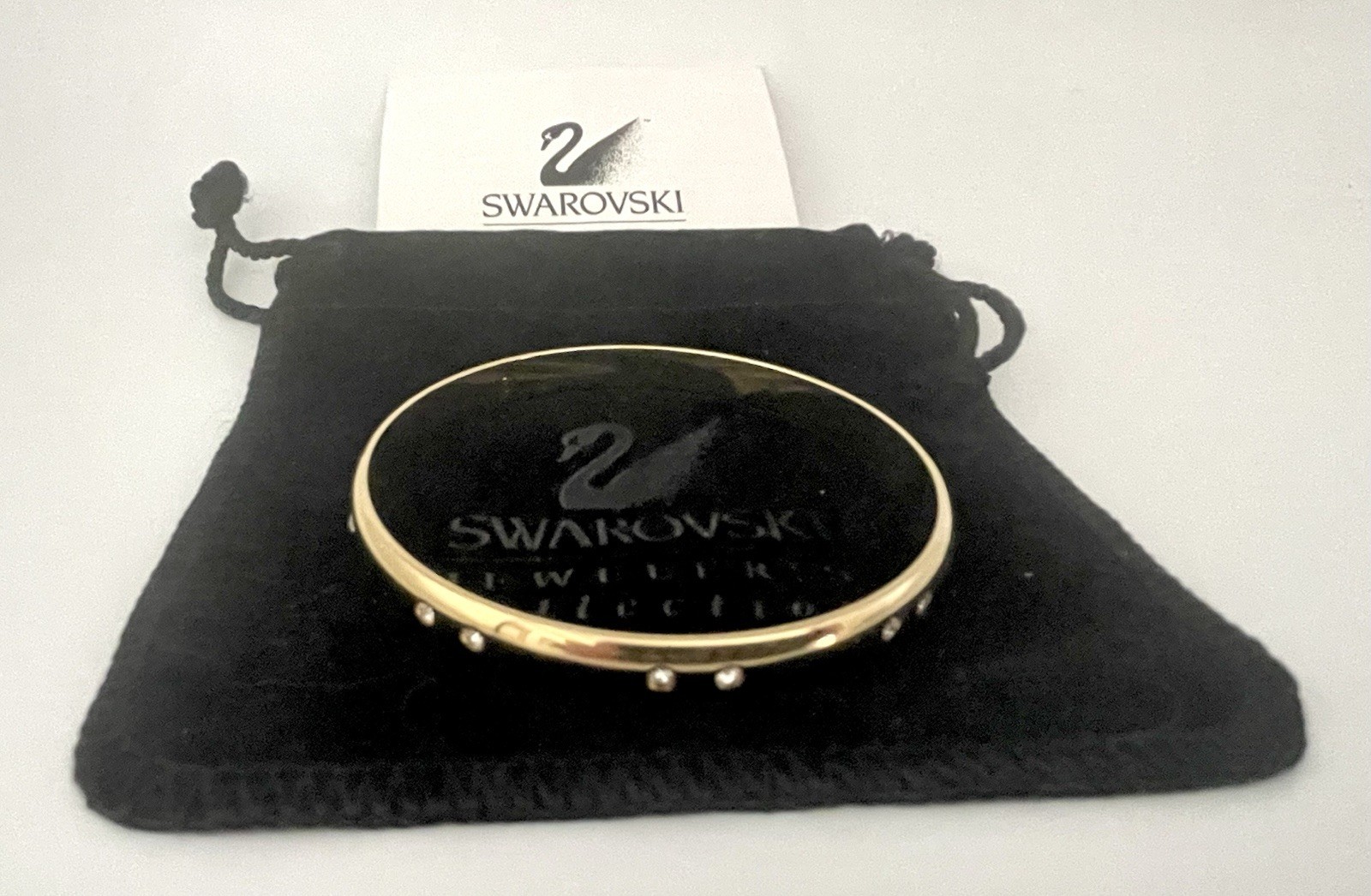 Swarovski Gold Tone Bangle Bracelet with Scattered Crystal Accents Swan Logo