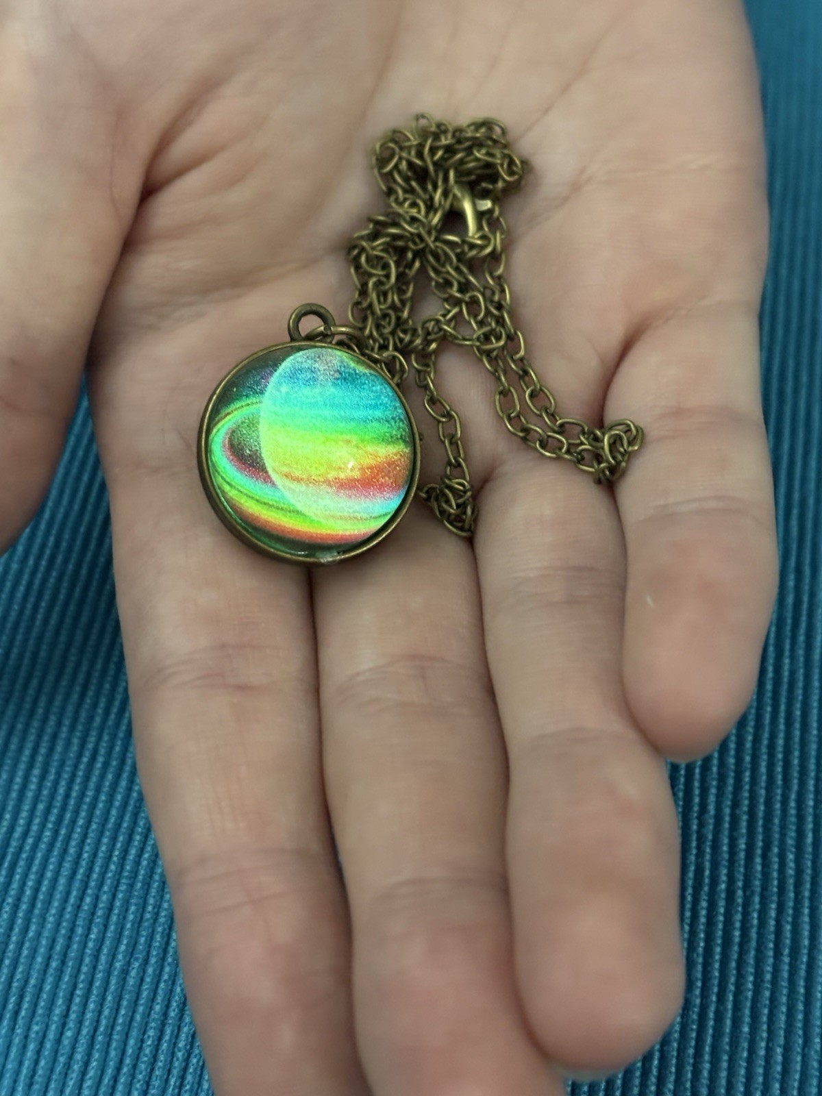 Saturn Glow in the dark Pendant necklace.