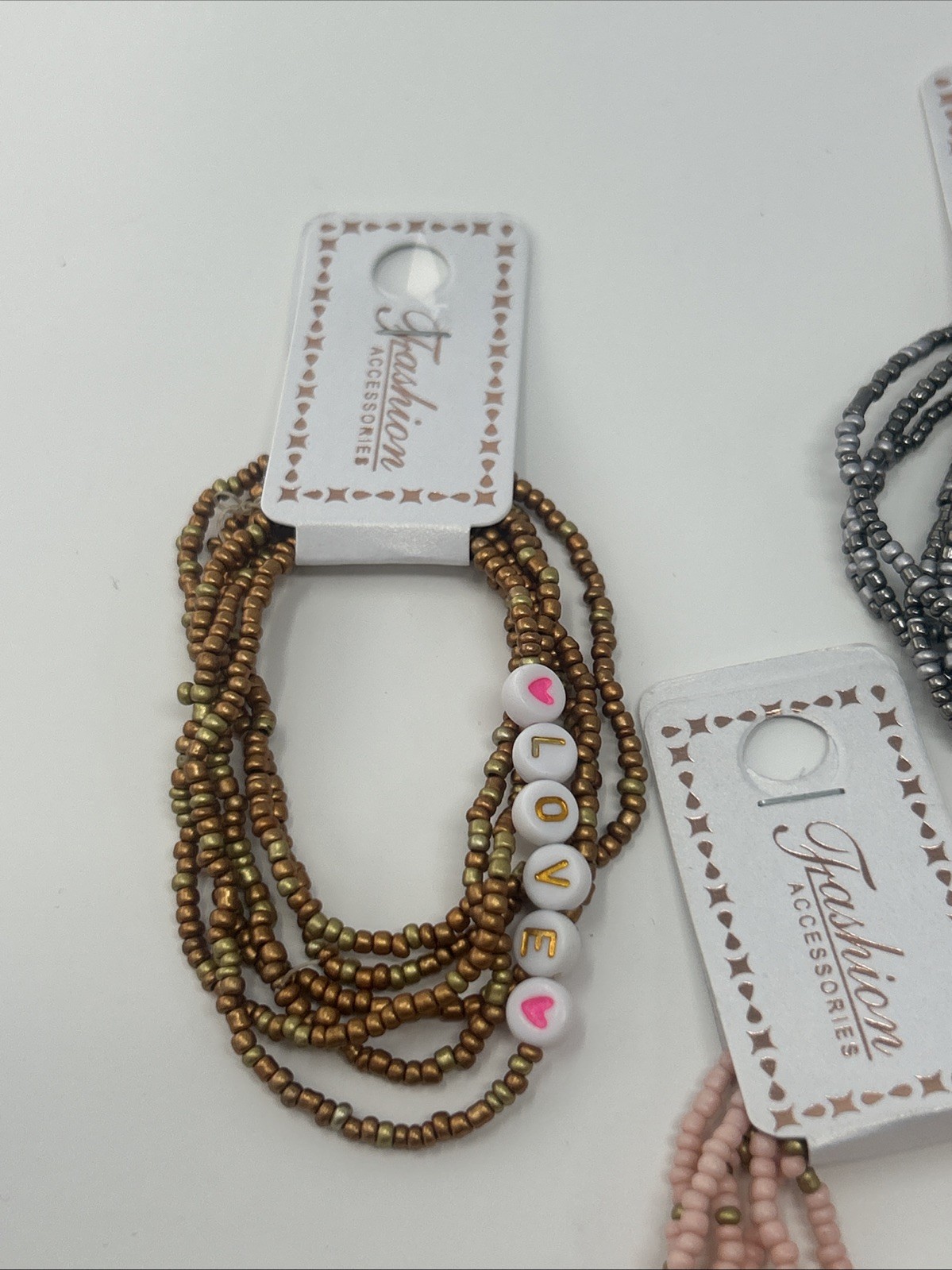 4 NWT Fashion Accessories Stacked Elastic Bead LOVE Bracelets Pink Cream Silver