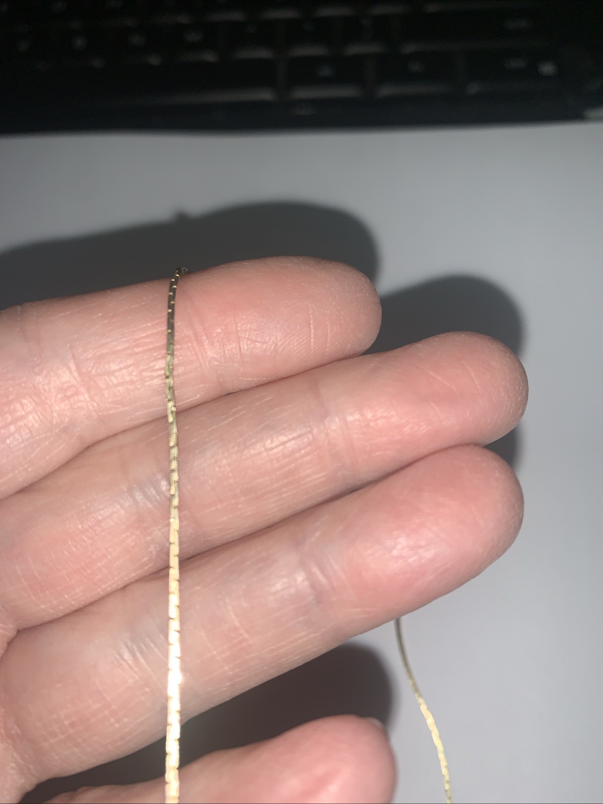 Thin flat gold tone patterned Chain with flat snake/herringbone appearance