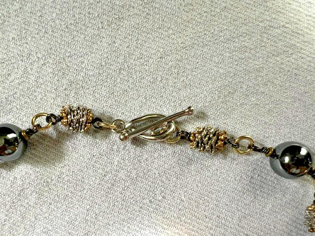 HEMATITE GRAY BEAD NECKLACE WITH SILVER/GOLD TONED SPACERS AND CABACHON PENDANT
