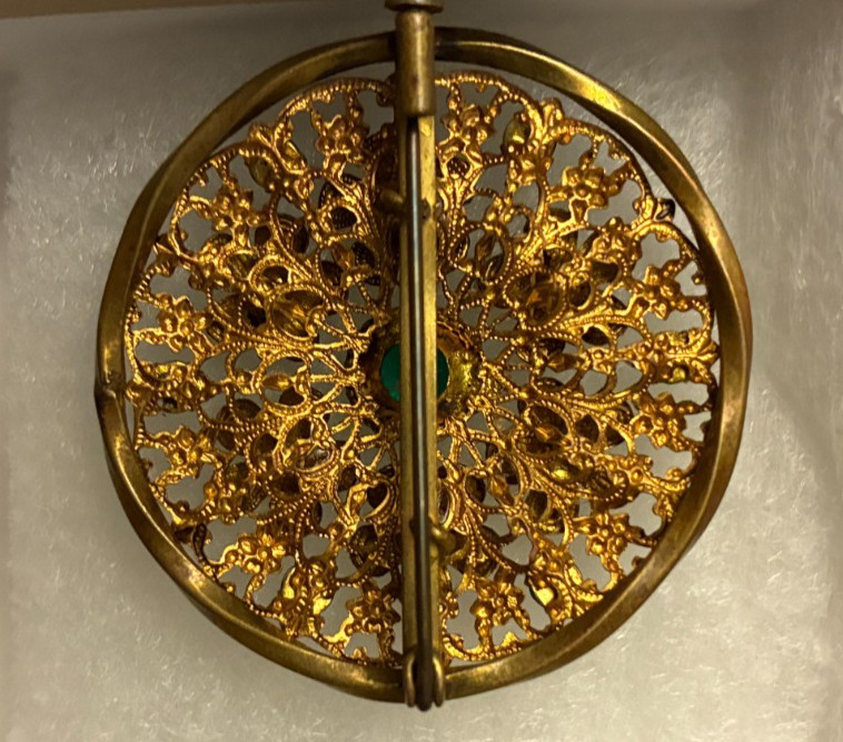 Round pin with green stones / 1.5 inch diameter / circa 1930s