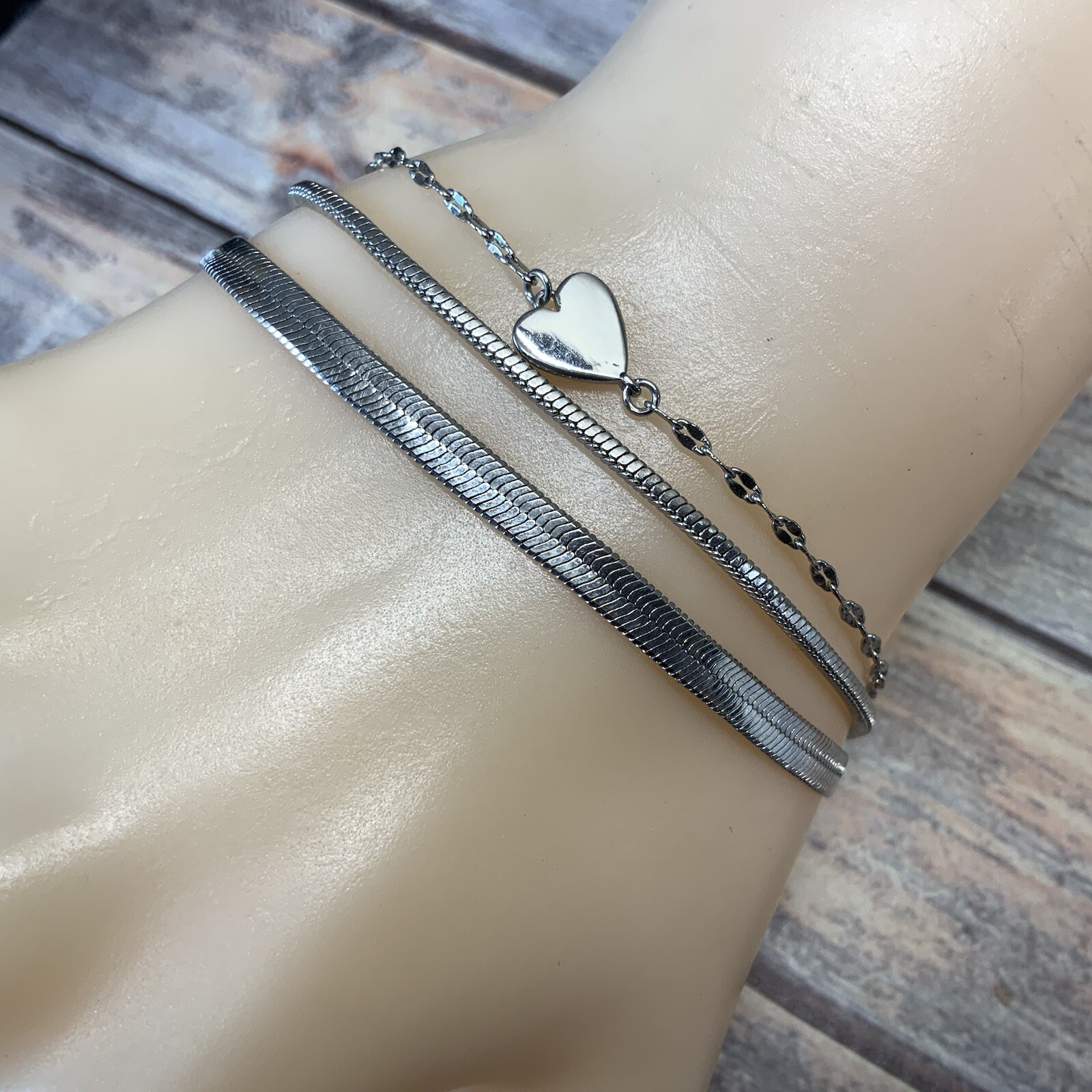 Modern adjustable layered herringbone chain heart bracelet in silver tone