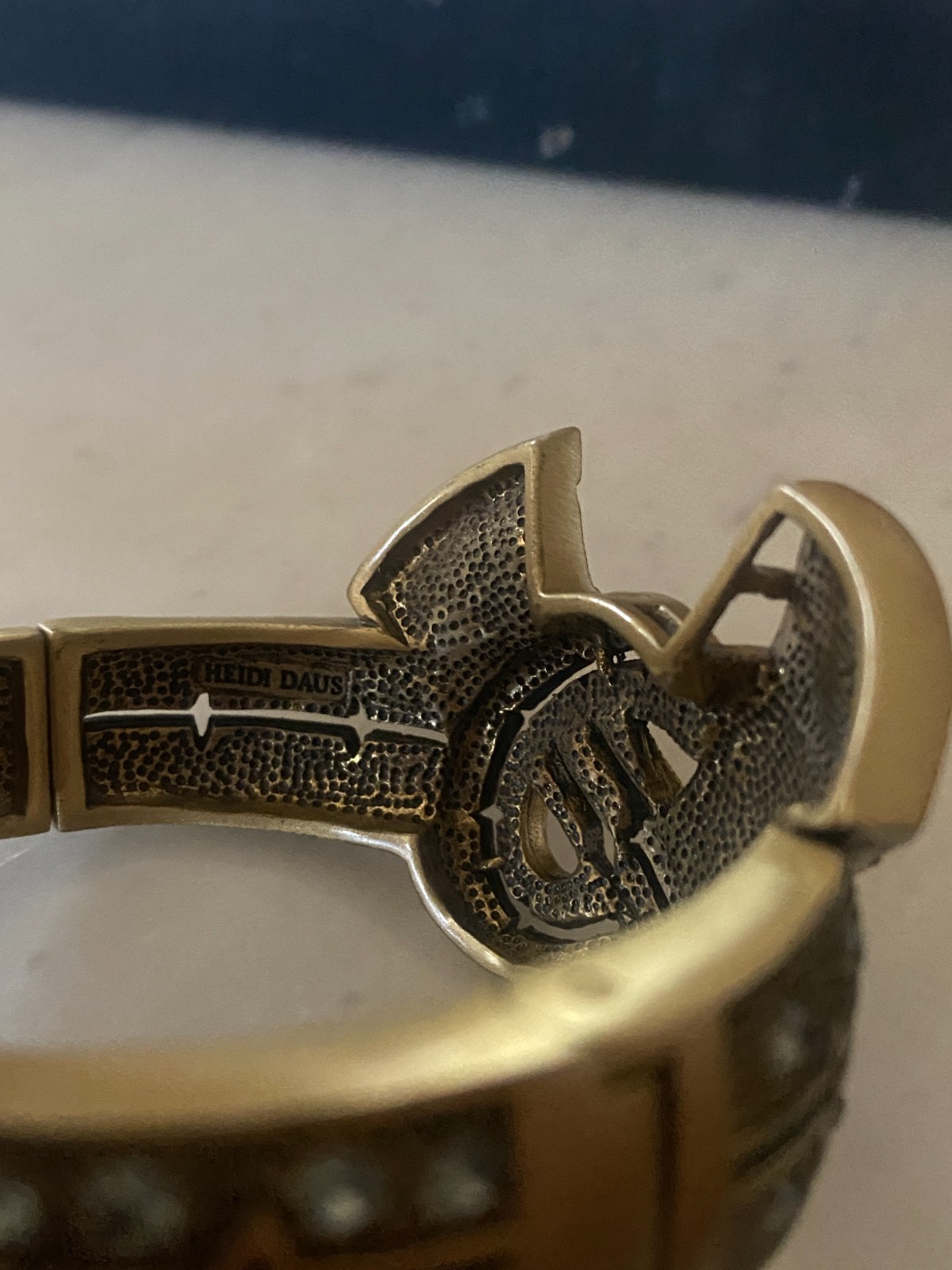 Heidi Daus Bow Ribbon Crystal Clamper Bracelet Gold Tone Filigree Hinged Cuff