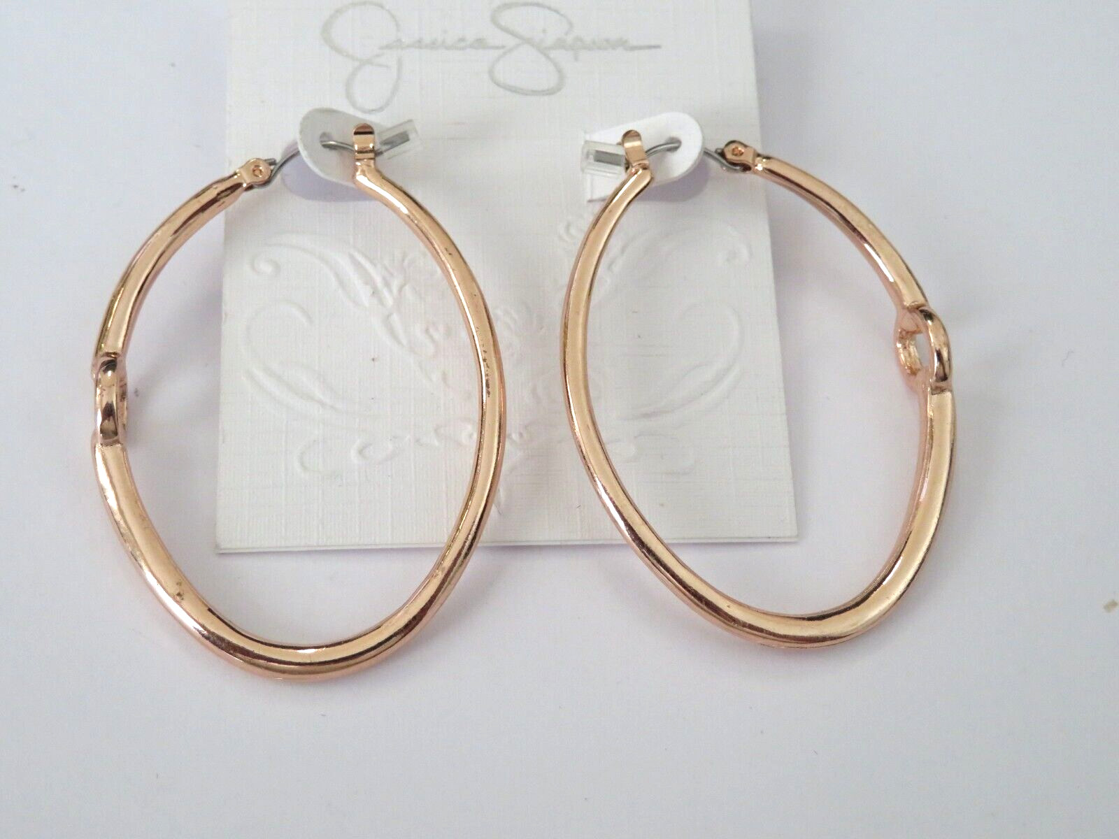JESSICA SIMPSON ROSE GOLD HOOP EARRINGS SADDLE LATCH