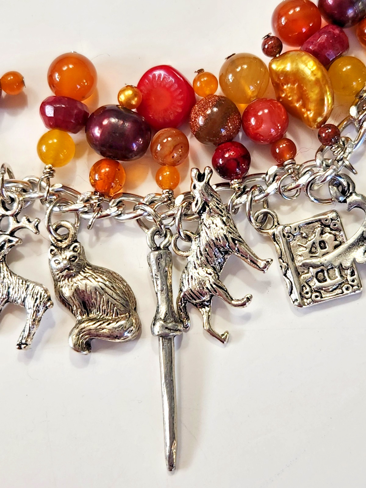 Silvertone Bracelet Multiple Dangle Charms Stone/Glass Beads Sword Lion Wolf
