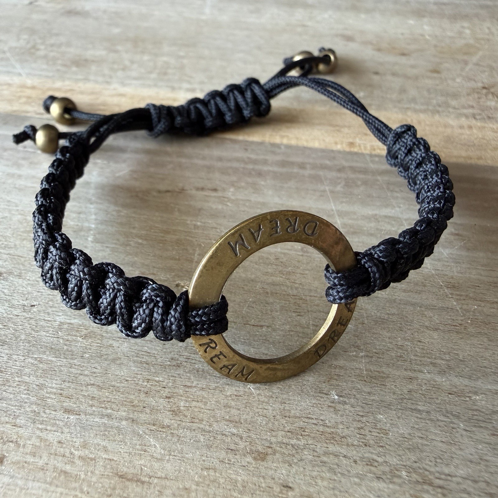 Black Braided Cord Bolo Bracelet, Adjustable Brass Round Ring Charm DREAM