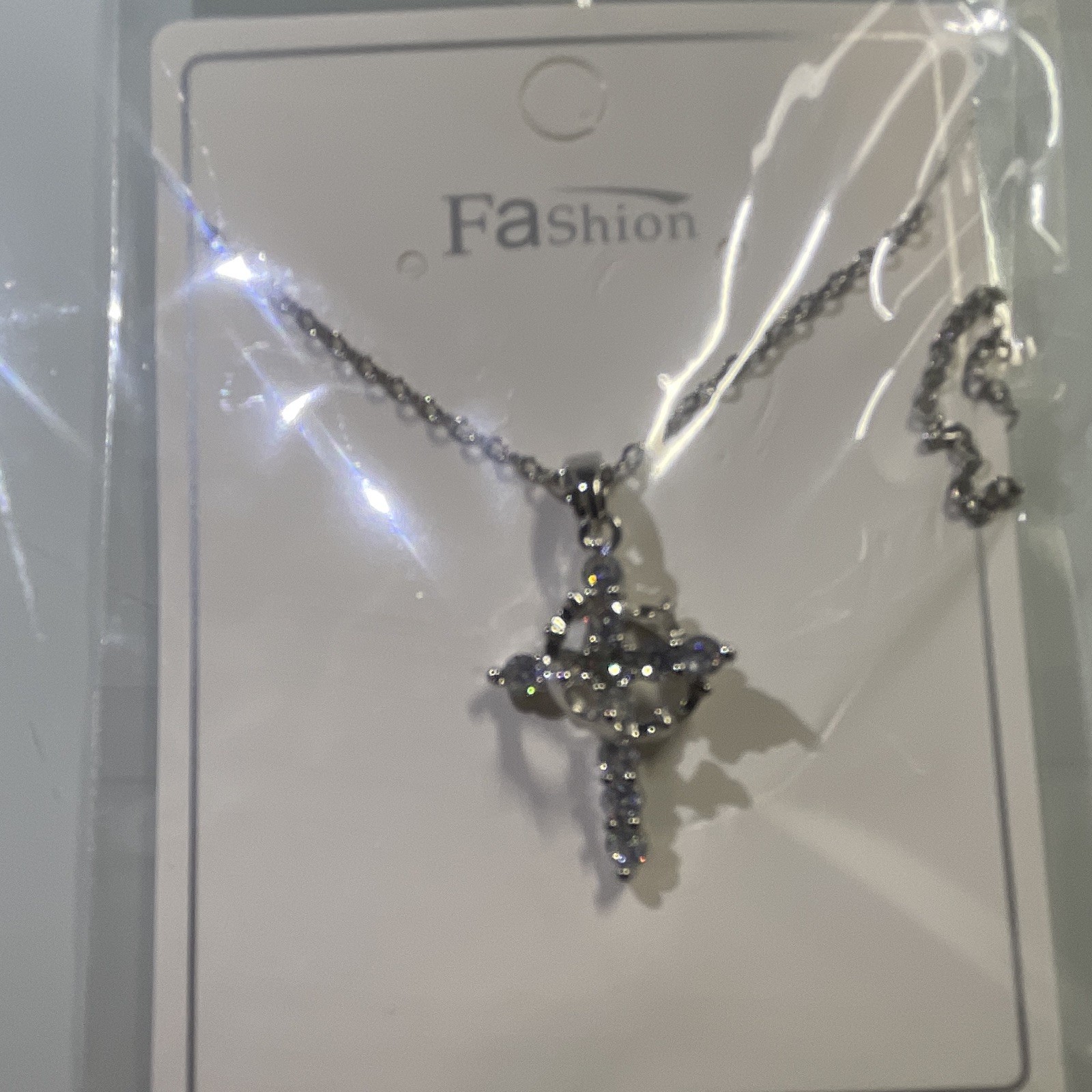 Rotatable crown and cross necklace