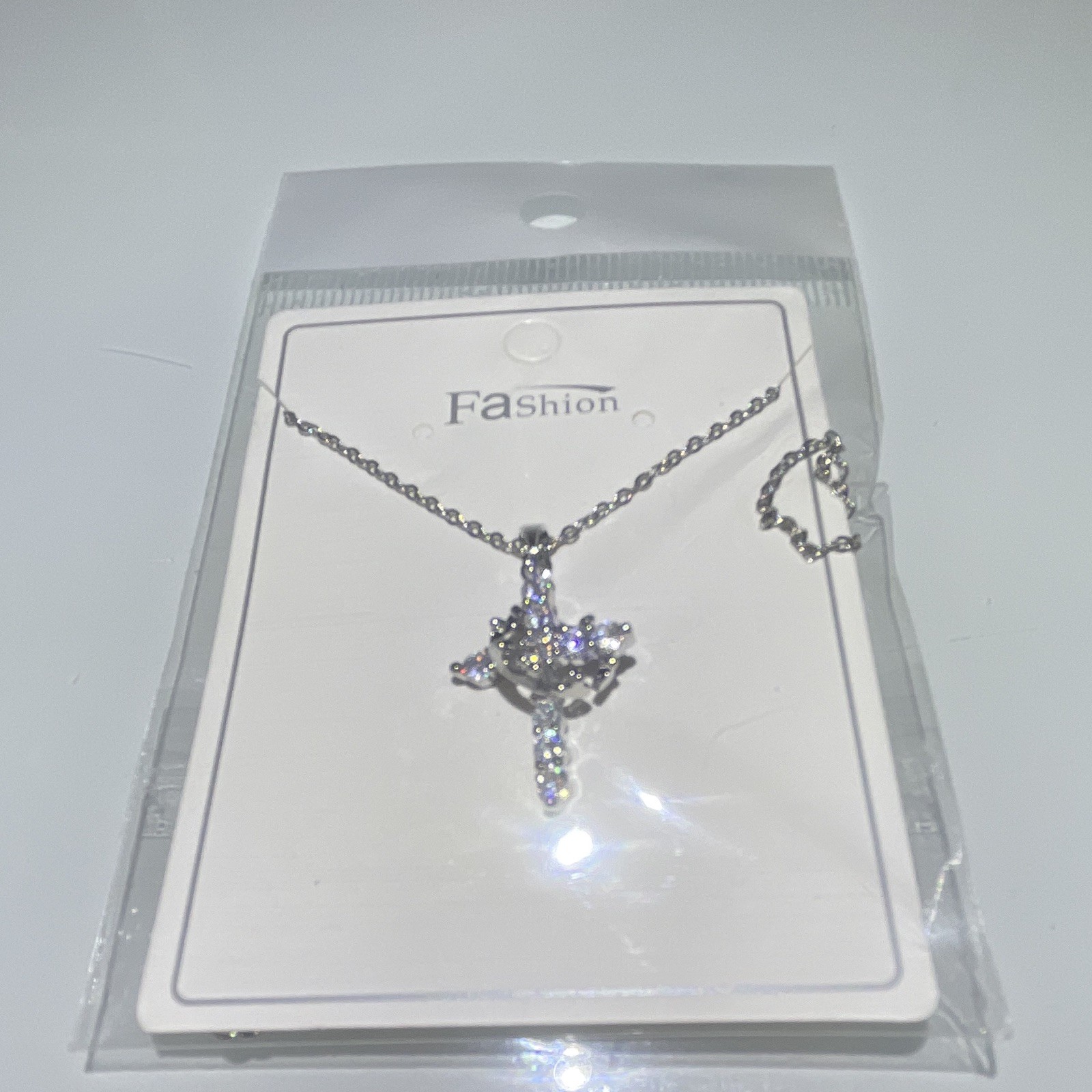 Rotatable crown and cross necklace
