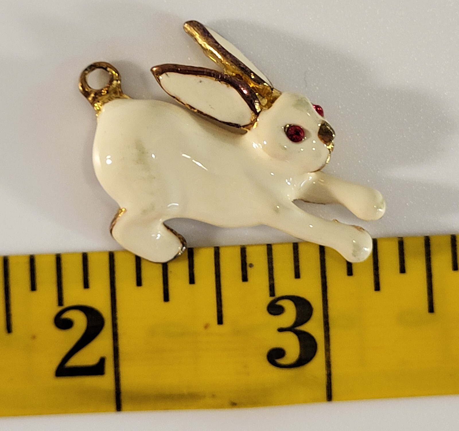 Enameled White Bunny Charm Made With Unknown Base Metal In Gold Color Red Eyes