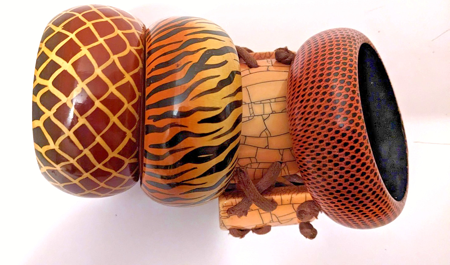 Vintage collection of 3 Wooden and 1x ceramic Fashion braclets in warm tones