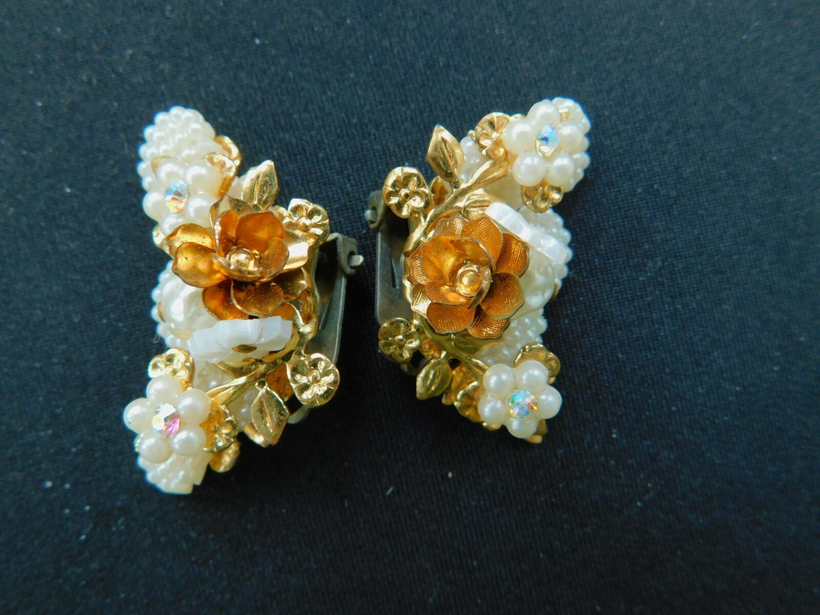 Pair of Vintage 1950’s White Plastic and Goldtone Metal Clip Earrings