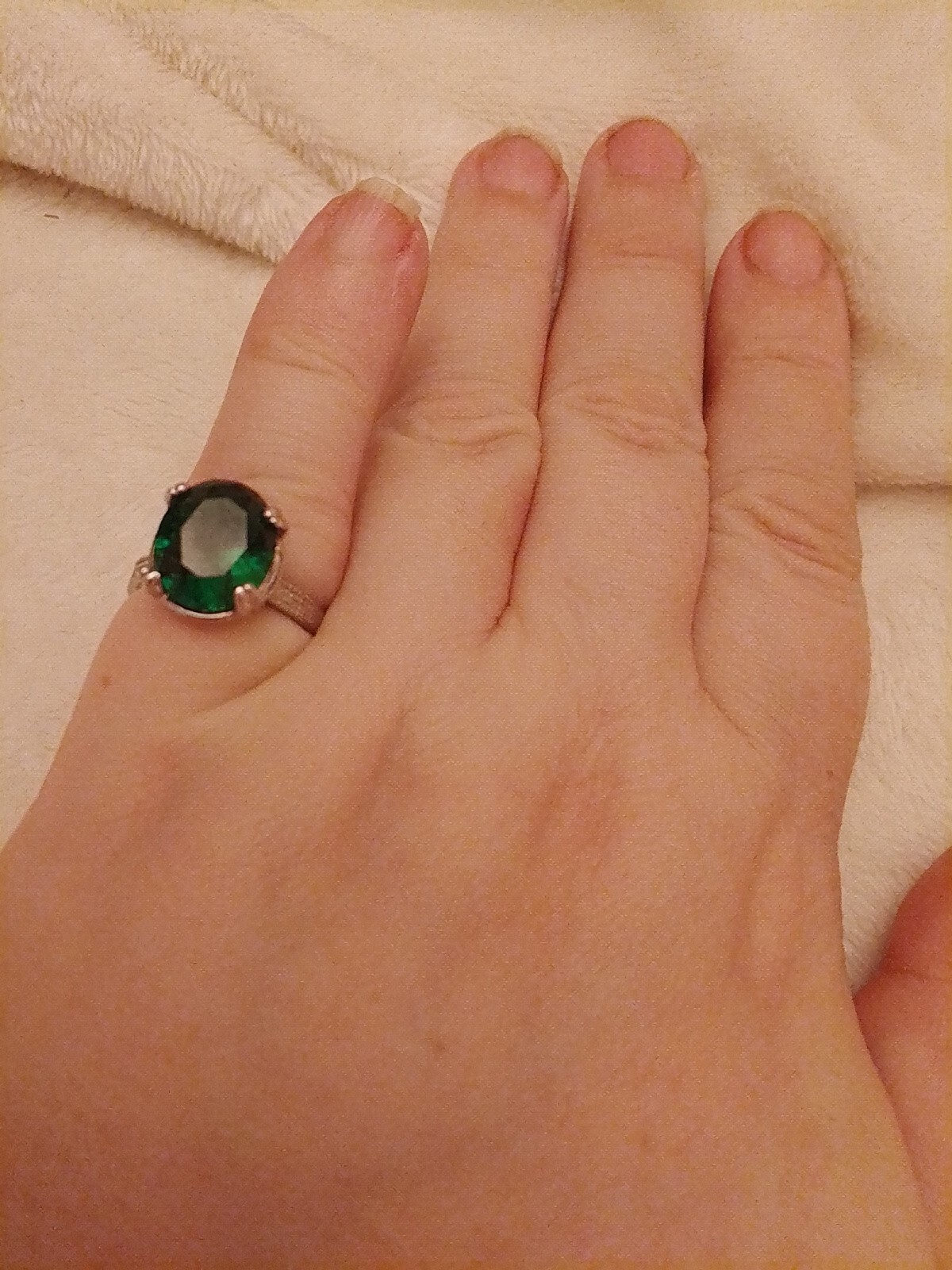 SizeUK J and USA 4.5 Possibly silver Green oval cut claw set ring