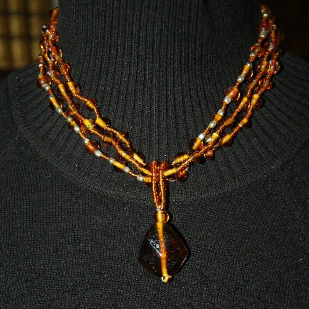 MULTI STRAND AMBER COLOR GLASS WITH LARGE GRIPOIX PENDANT STATEMENT NECKLACE