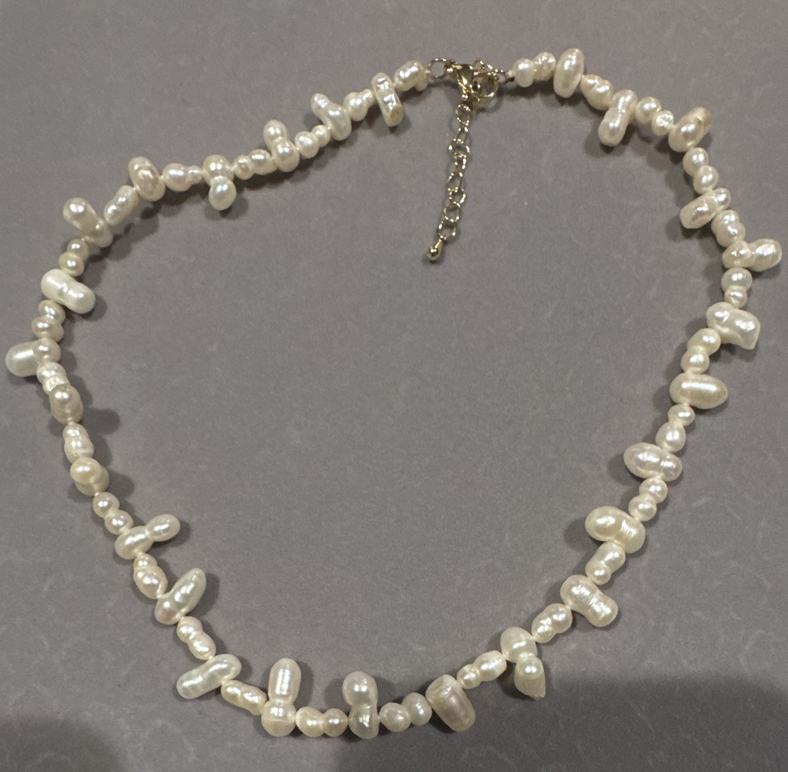 Genuine white freshwater pearls. 4-6 mm in micron setting.