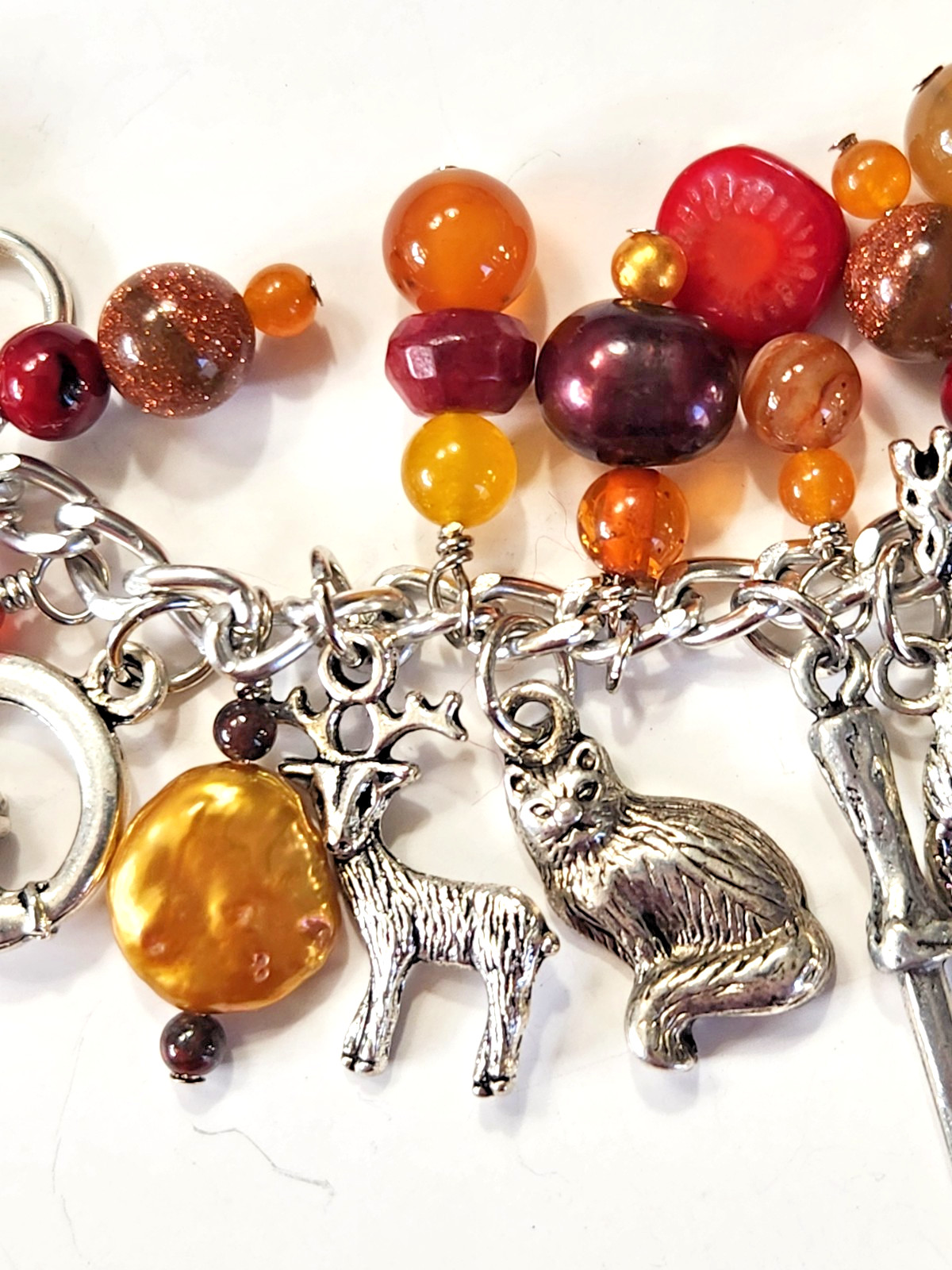 Silvertone Bracelet Multiple Dangle Charms Stone/Glass Beads Sword Lion Wolf