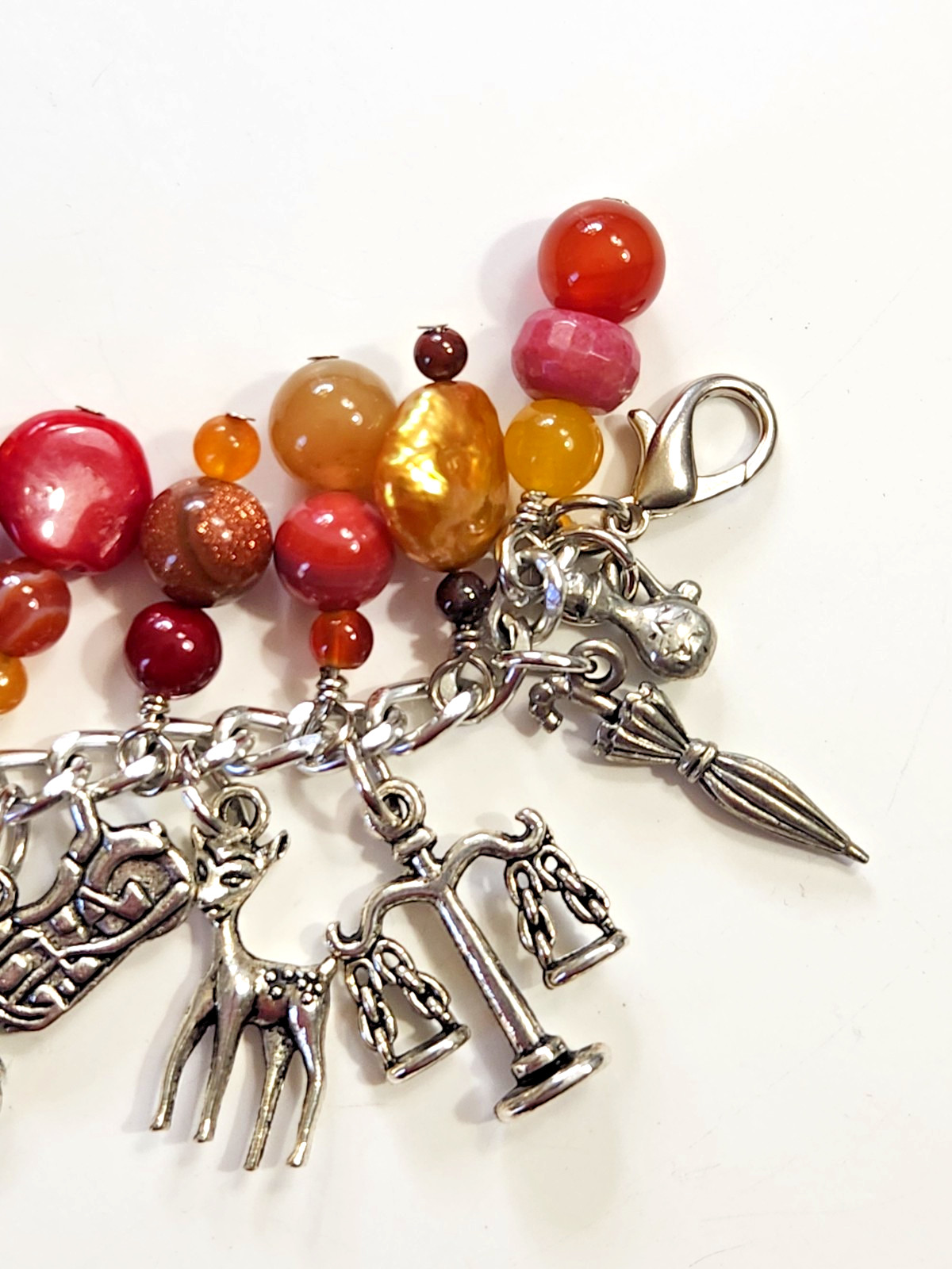 Silvertone Bracelet Multiple Dangle Charms Stone/Glass Beads Sword Lion Wolf