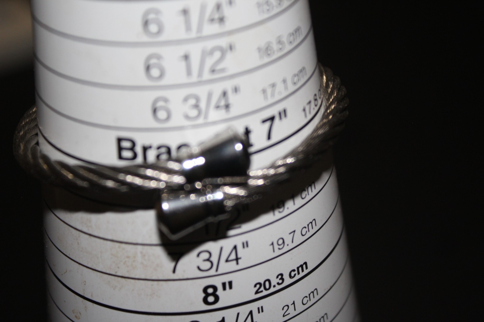 Black or Silver over Stainless Twisted Bracelet-Silver Encaps – Fits All Wrists