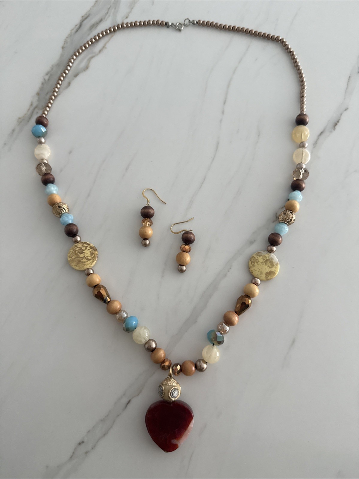 This bohemian-style jewelry a multi-textured beaded necklace & matching earrings