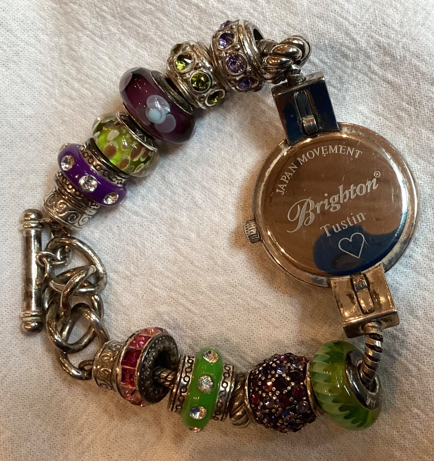 Brighton “Tustin” Silver Plated Watch with 11 Green and Purple Glass Beads