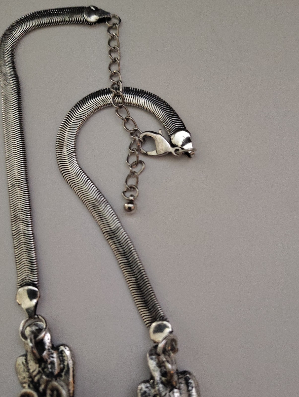 Beautiful silver/tone feather statement necklace