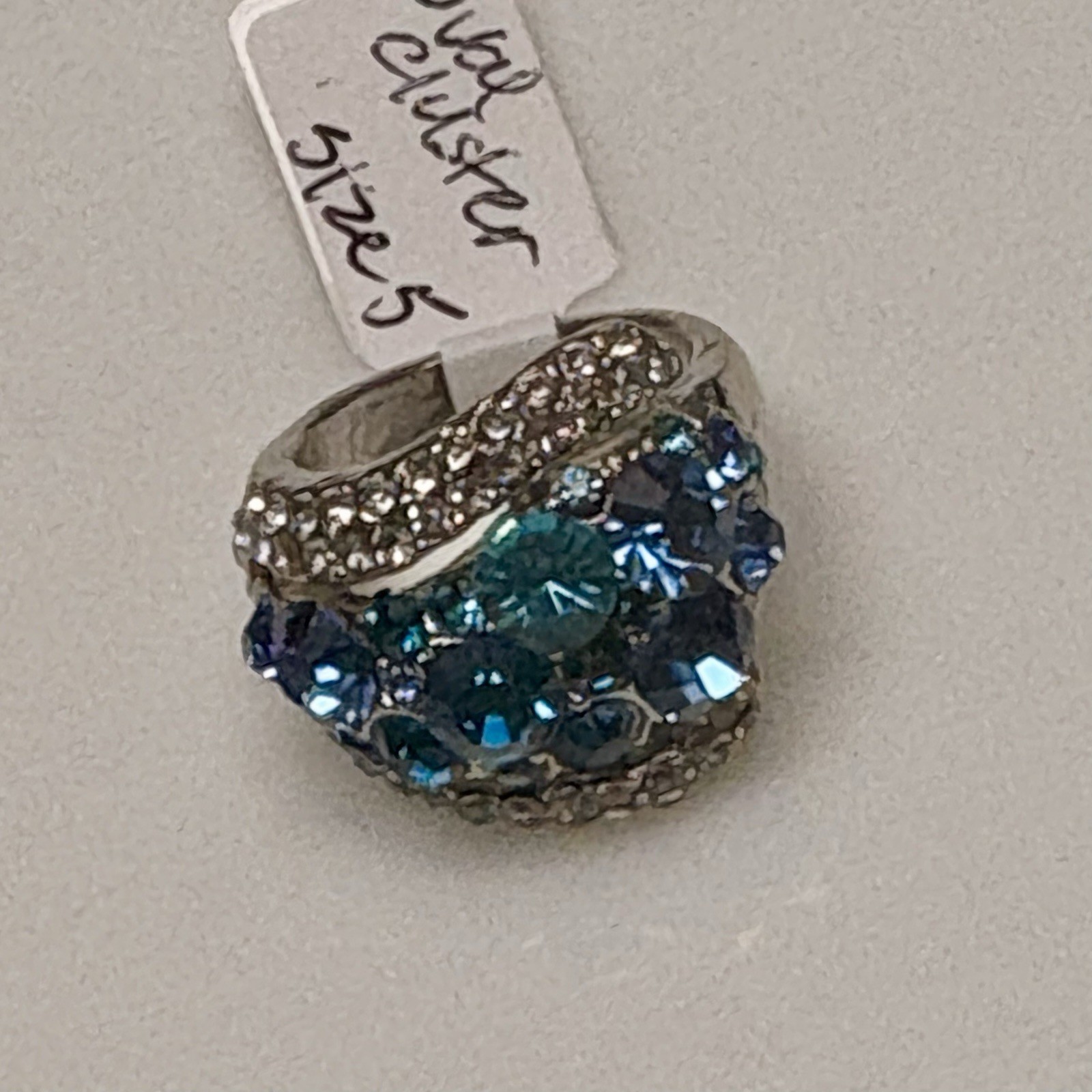 Silver tone statement ring w/sparkling blue & teal crystal cluster. Size 5 & 5.5