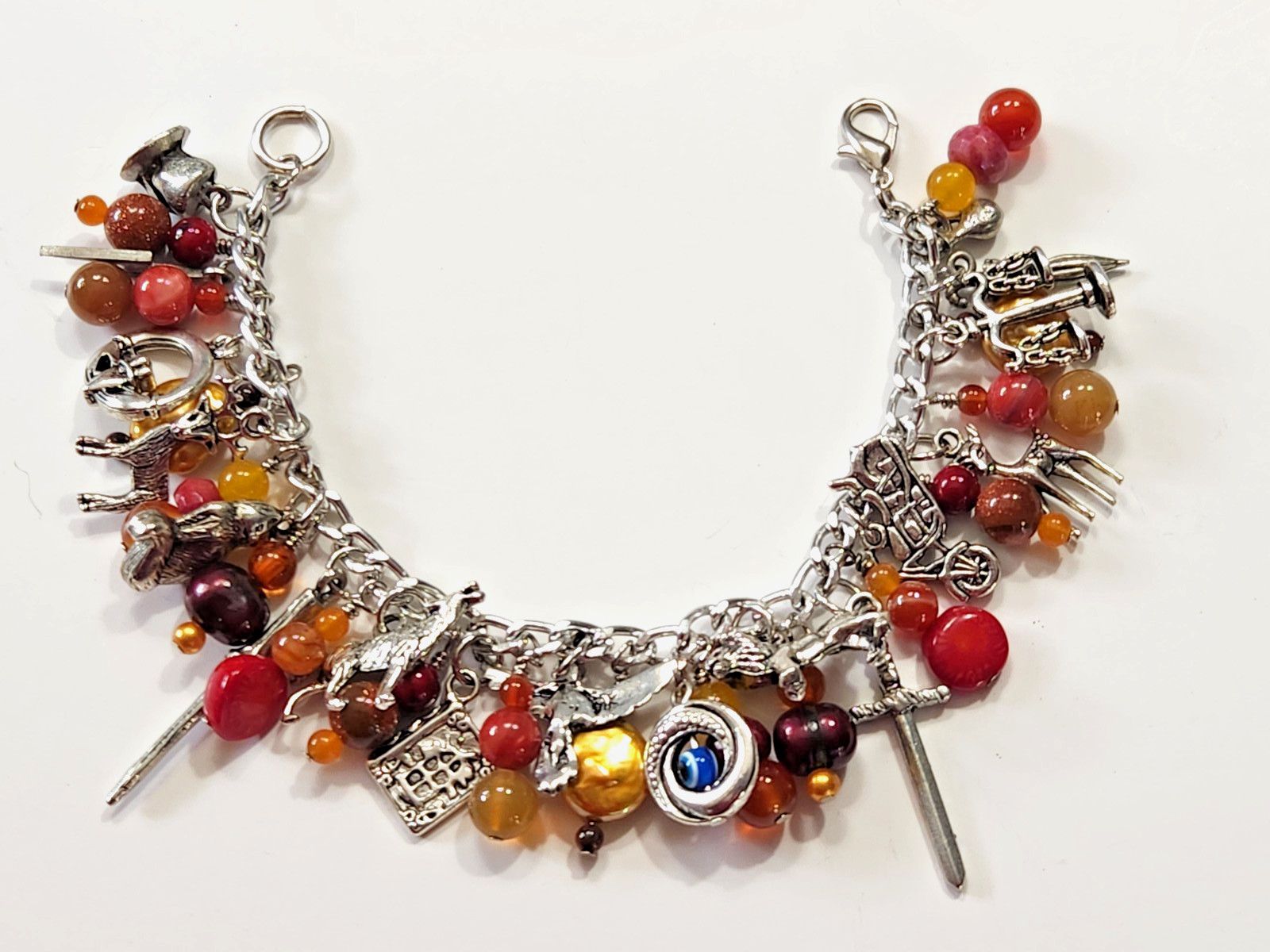 Silvertone Bracelet Multiple Dangle Charms Stone/Glass Beads Sword Lion Wolf