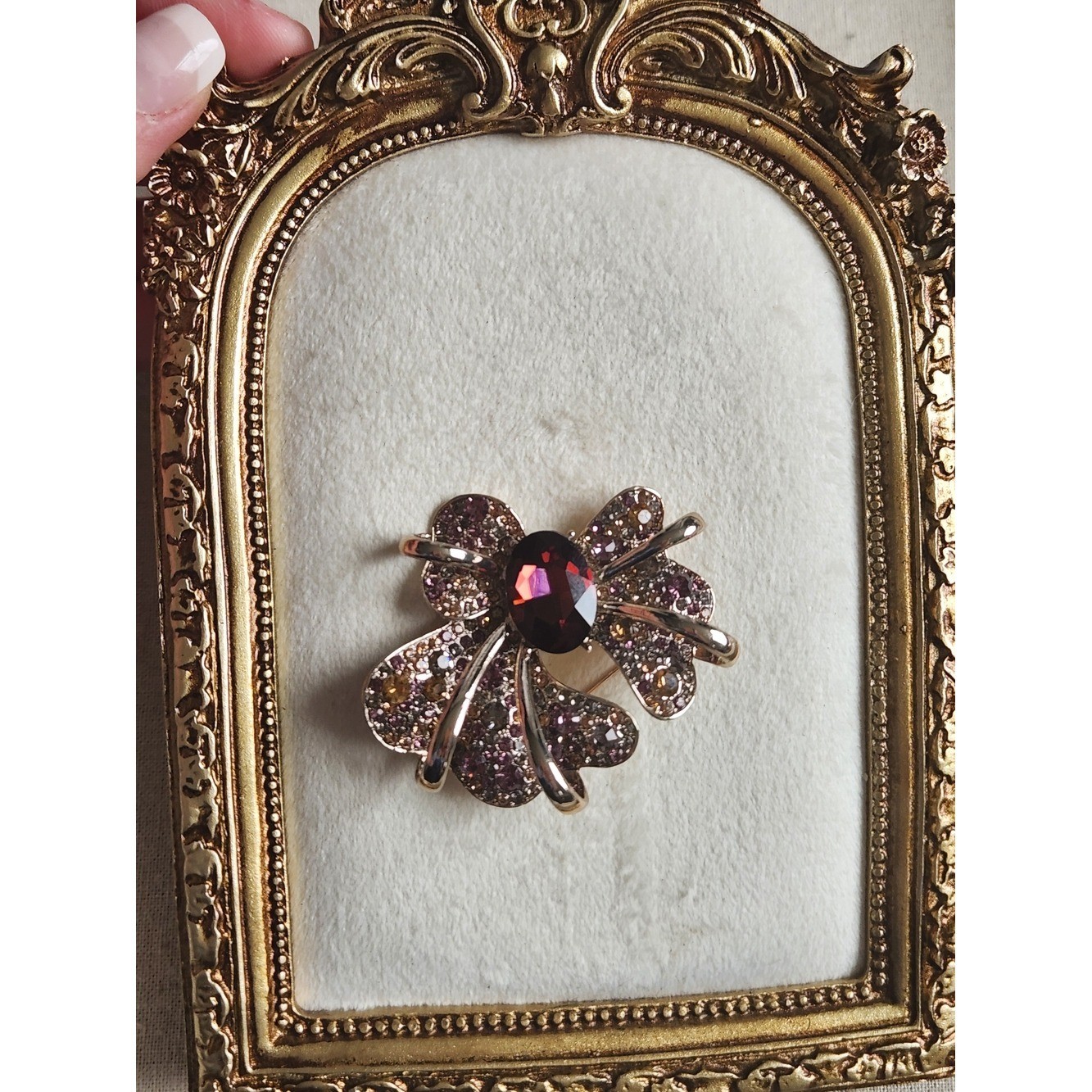 Gold-Tone Bow Brooch with Garnet-Center and Pink/Champagne Crystals