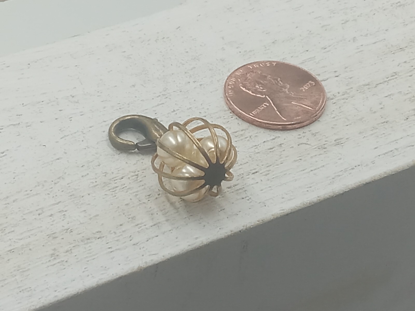 John Wind Caged Pearl Charm with Lobstaer Claw Brass ans Pearl