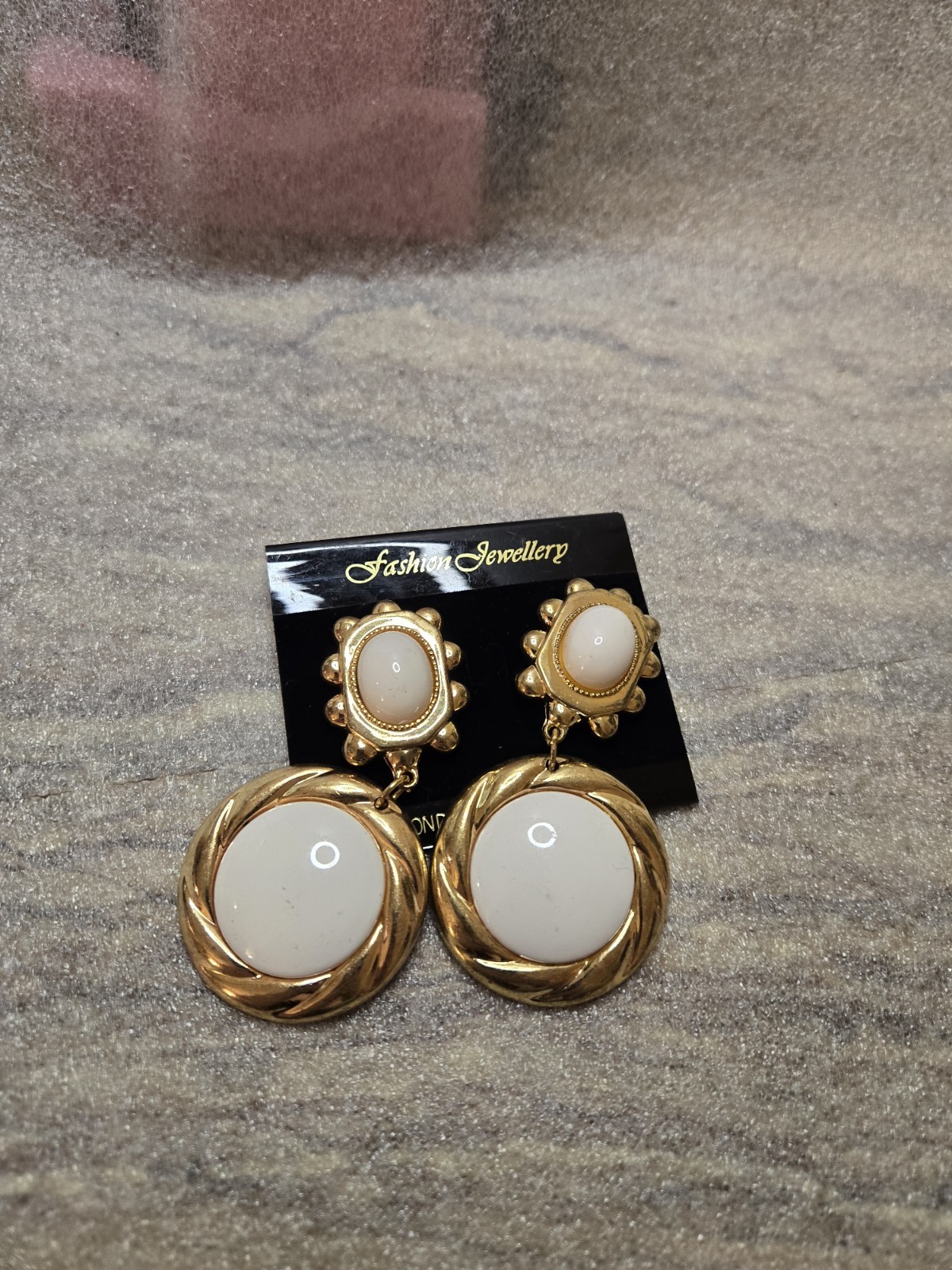 Fashion Jewellery branded clip-on earrings feature a gold-tone, rope-textured…