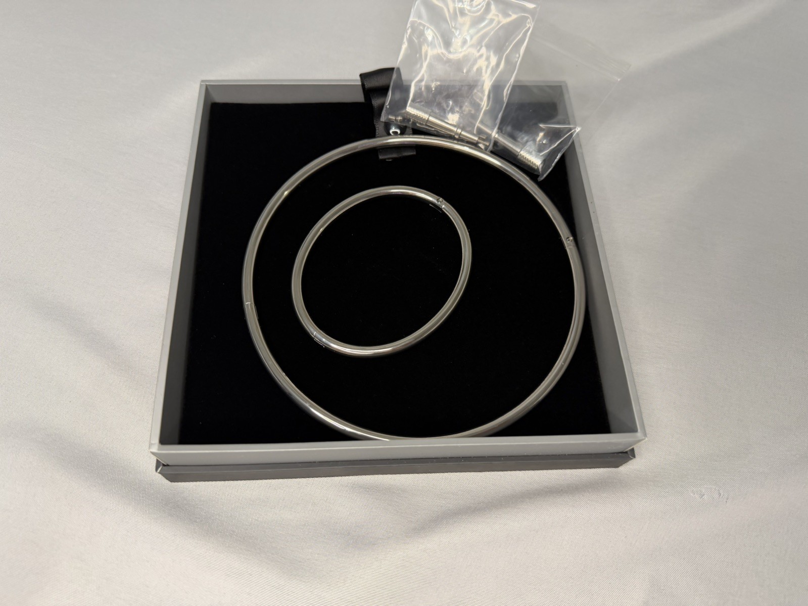 Petite Polished Locking Eternity Collar Titanium With Key,and a Bracelet.