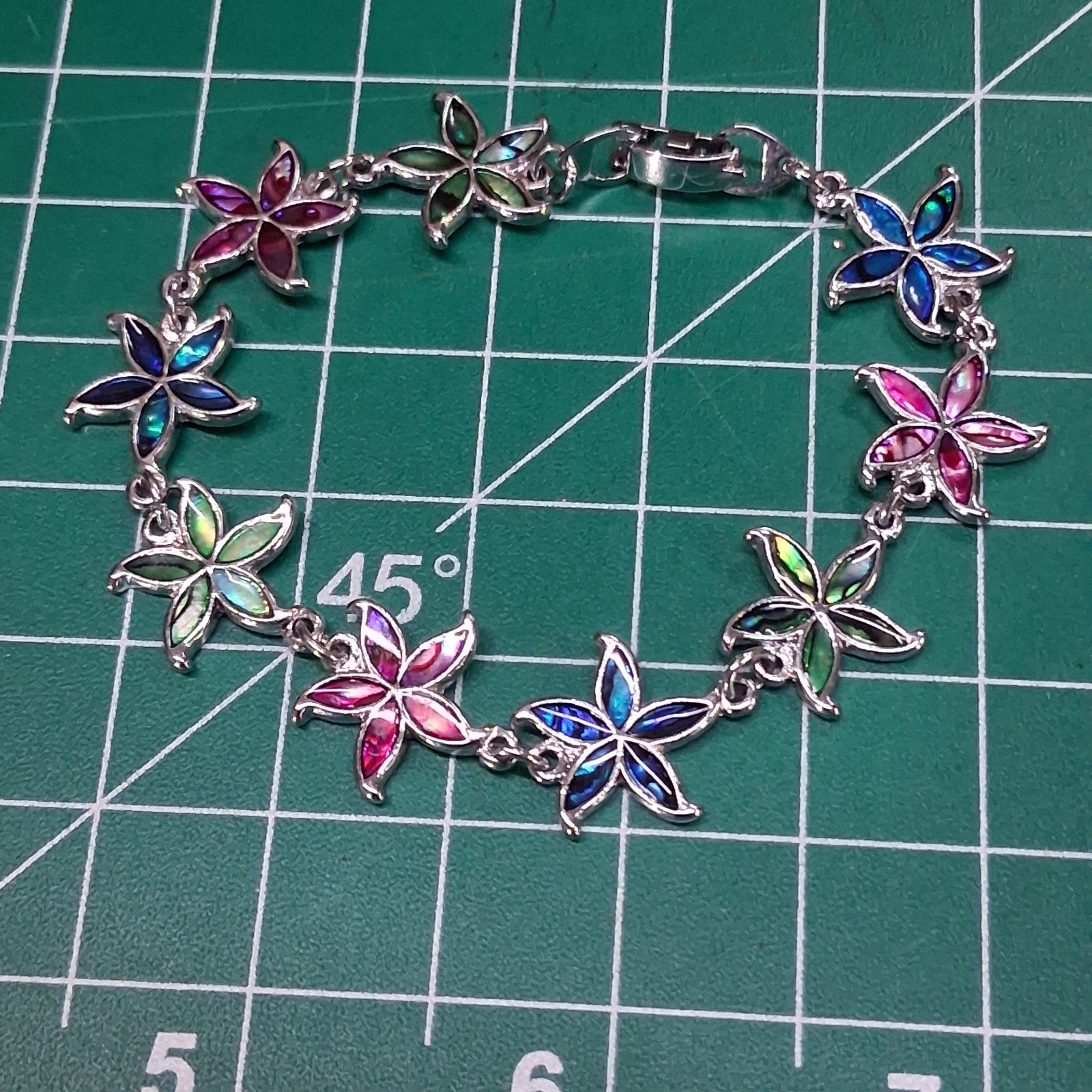 Shimmering Multicolor Linked Starfish Design Fold Over Clasp Chain Bracelet