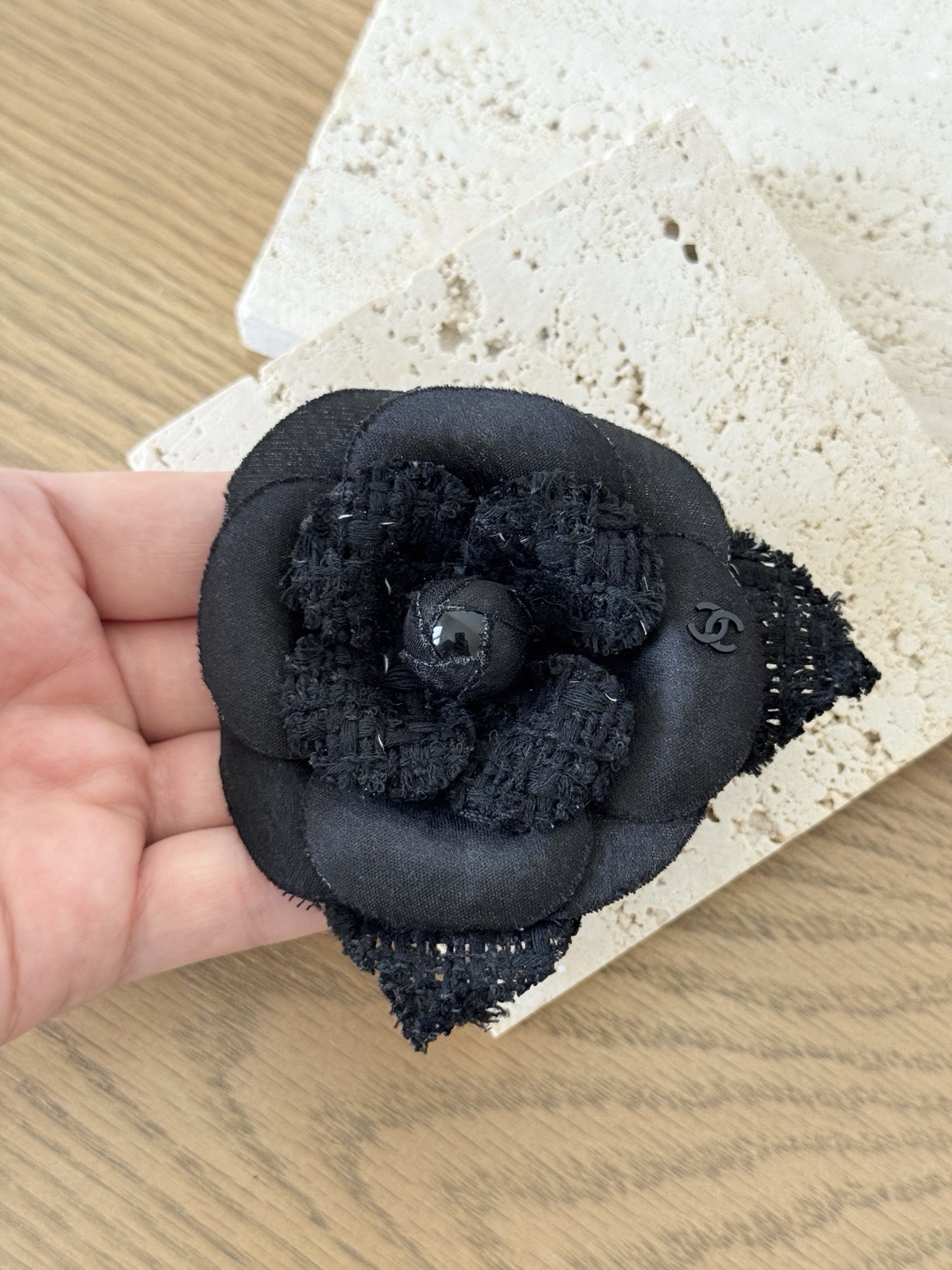 CHANEL Camélia Brooch crafted from black tweed/canvas