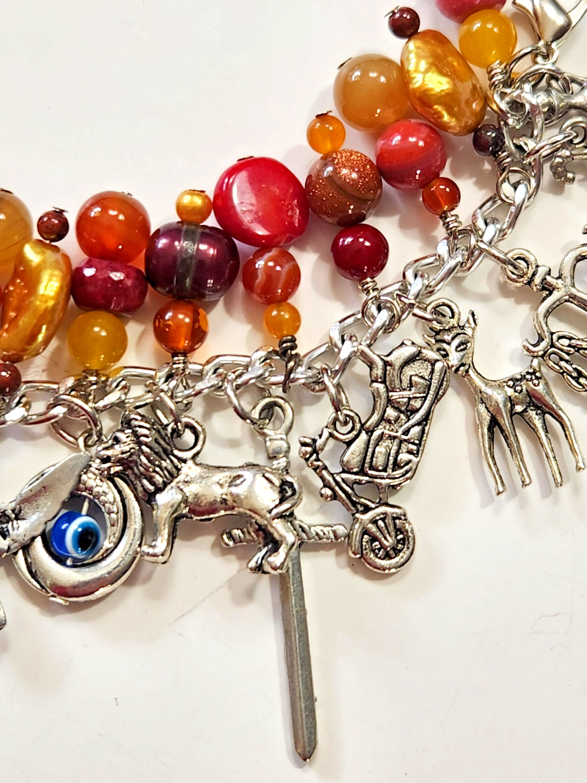 Silvertone Bracelet Multiple Dangle Charms Stone/Glass Beads Sword Lion Wolf