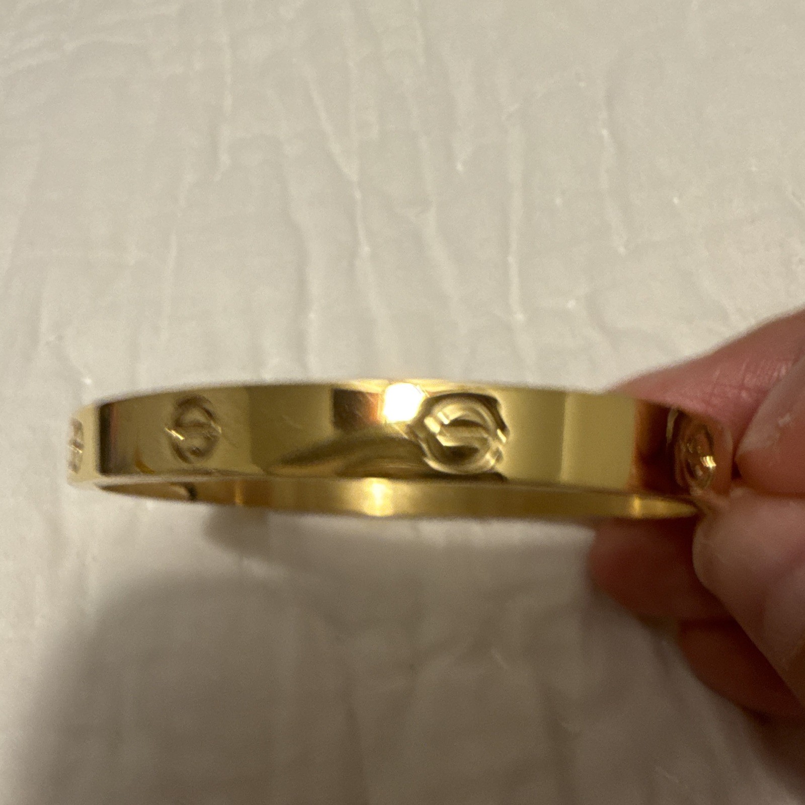 Gold Tone Logo Motif Bangle Bracelet, No Stone, Gold Color Jewelry