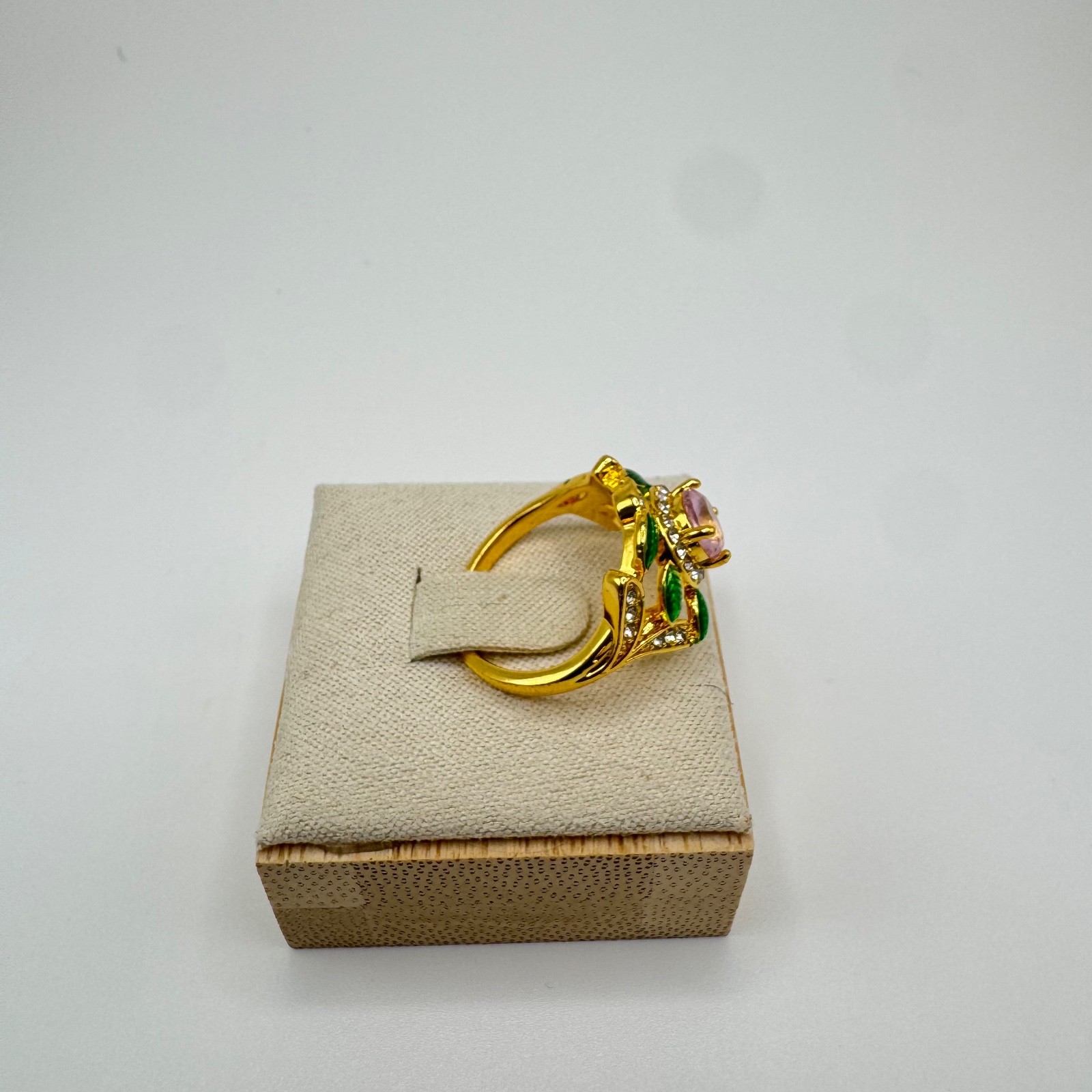 Gold tone statement ring bundle with one central stone and ornate accent stones
