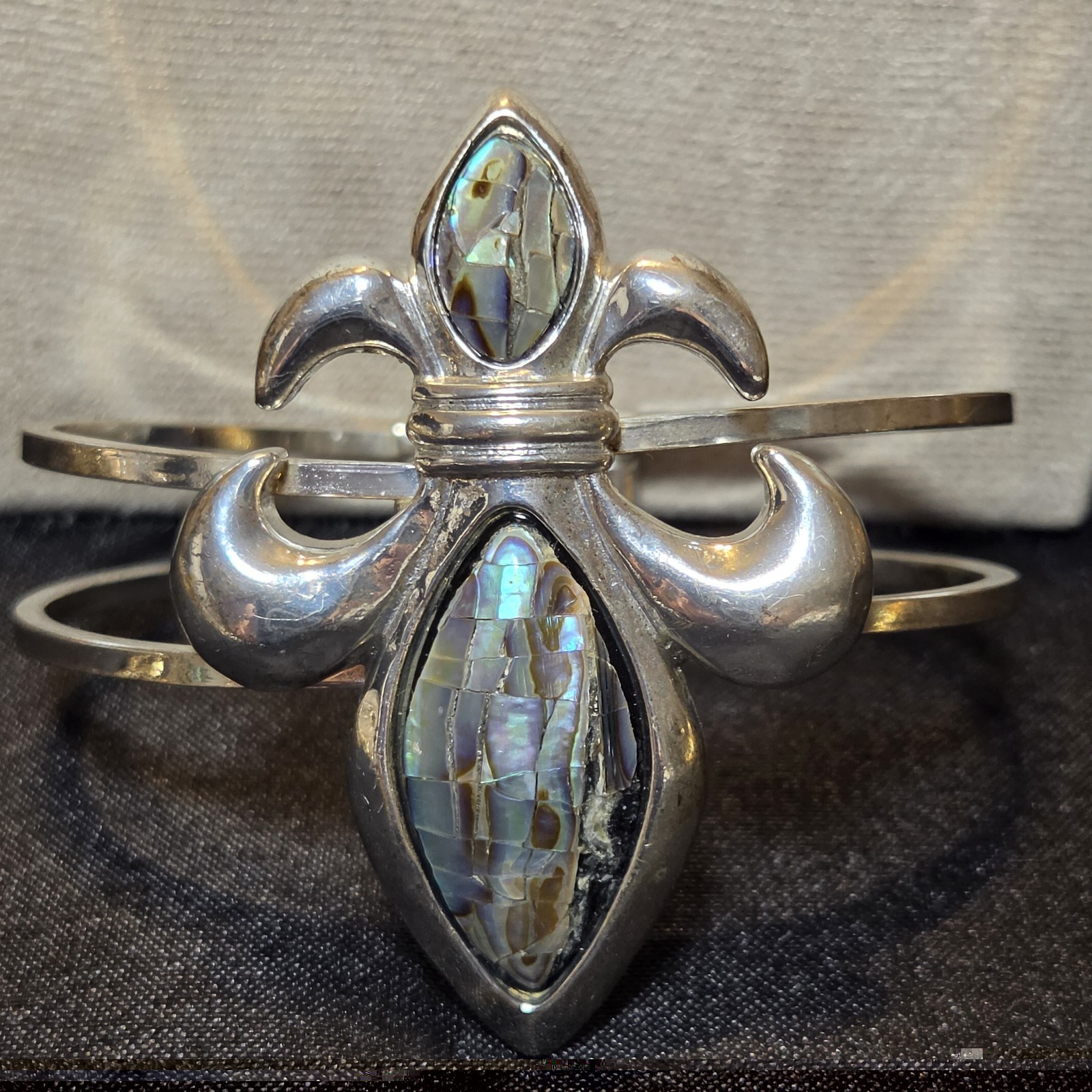 Elegant Fleur-de-lis Cuff With Shimmering Abalone Shell In Silver-tone.