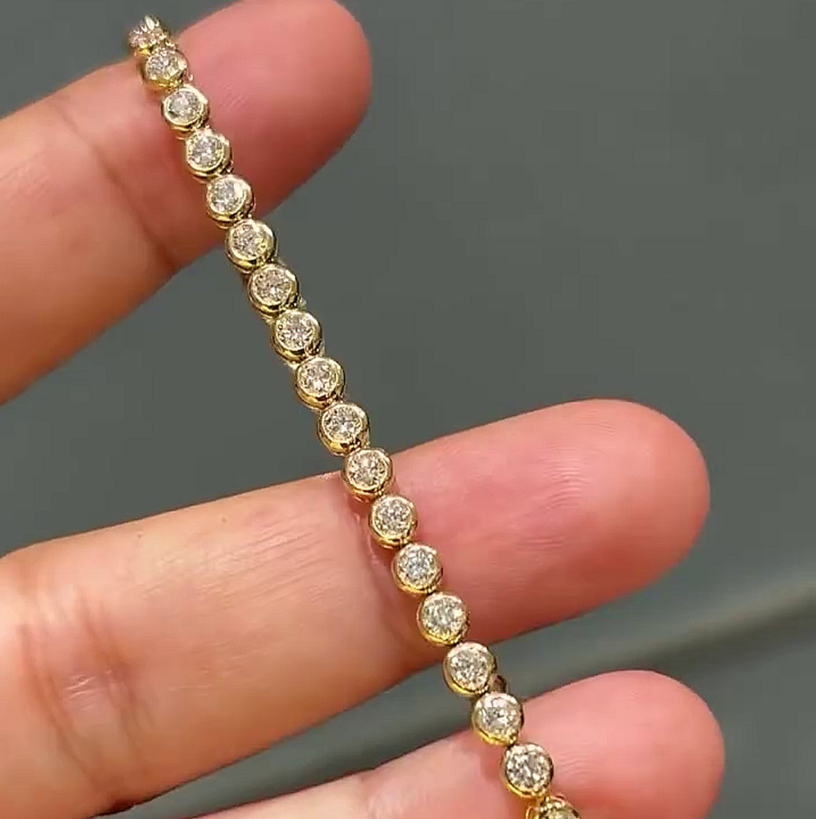 7.0ctw Round Cut Moissanite Bezel Set Tennis Bracelet In 14K Yellow Gold Plated